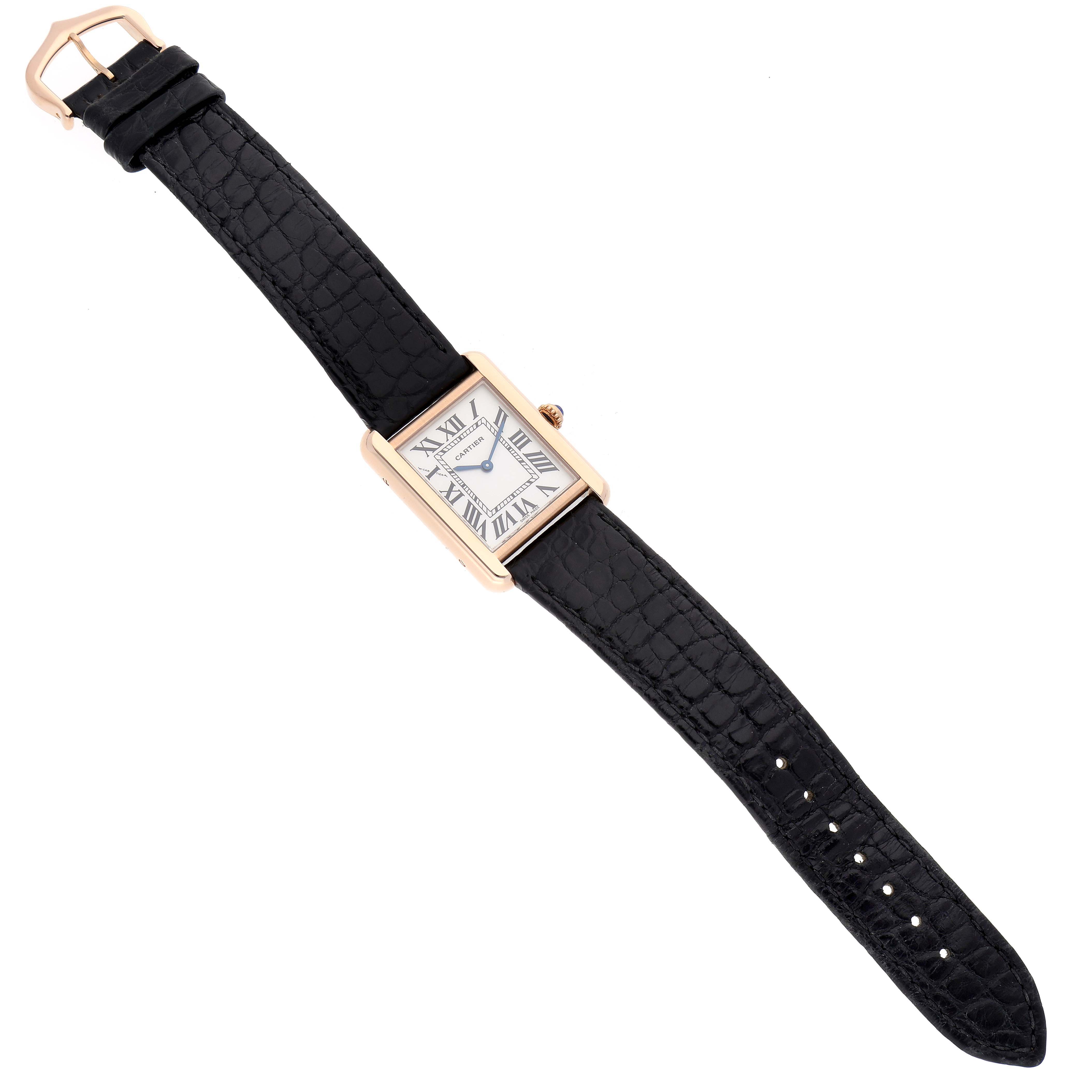 The Tank Solo model by Cartier is shown at a slight overhead angle, displaying the face, strap, and buckle.