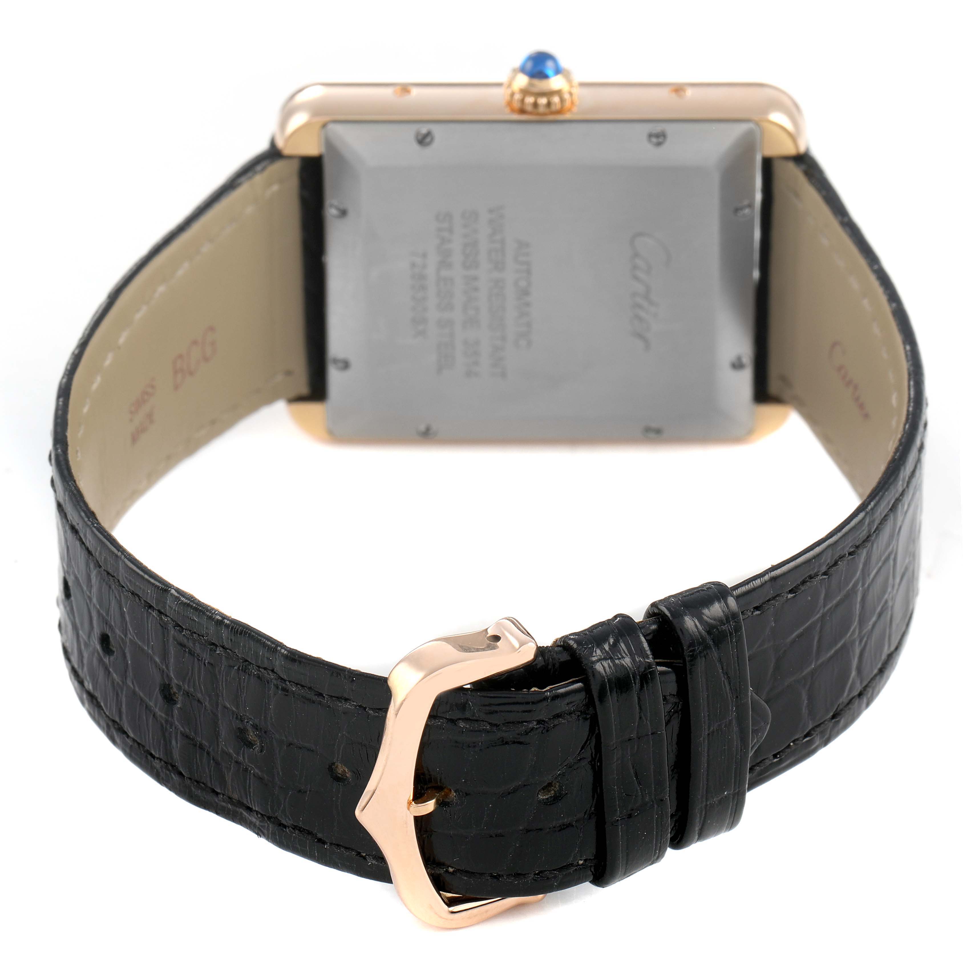 The image shows the back of the Cartier Tank Solo W5200026 Men's Rose Gold Silver Dial watch, highlighting the case back and leather strap with the clasp.