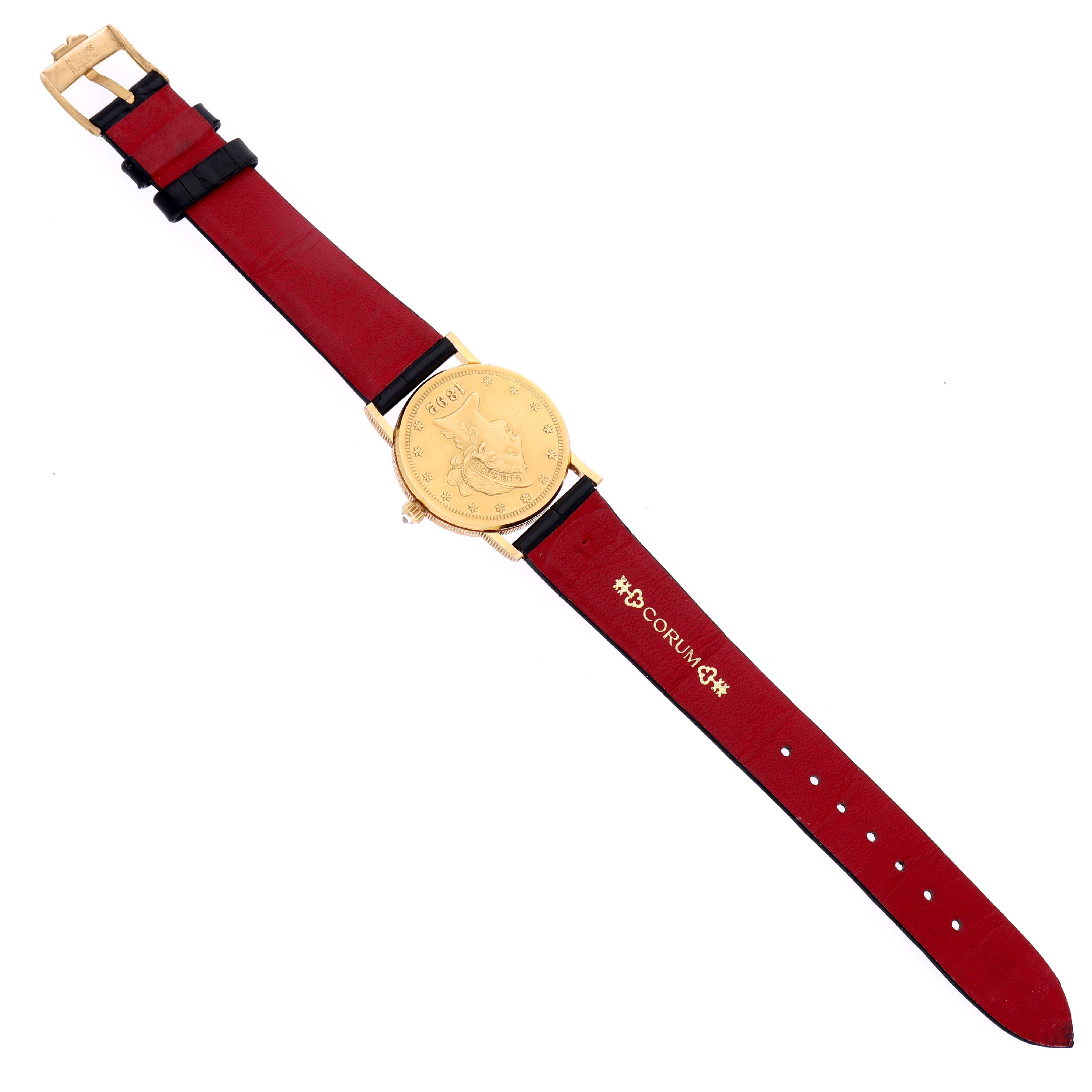 The Corum 5014856 V41 Women's Yellow Gold Champagne Dial 5014856 V41 Women's Yellow Gold Champagne Dial Coin 10 Dollars Double Eagle Yellow Gold Ladies Watch 1892 is shown from above, displaying its coin-style face and red strap.
