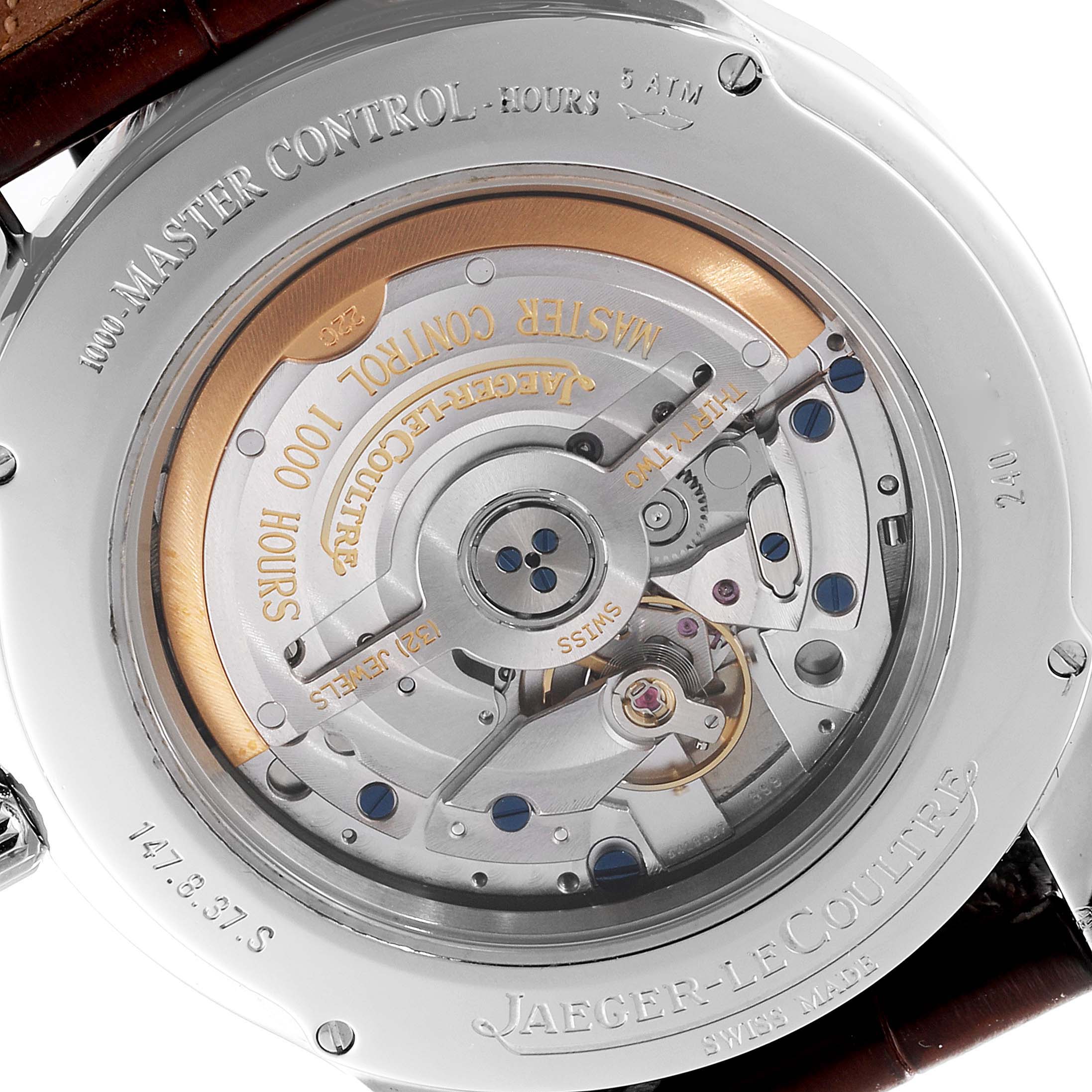 The image shows the rear view of a Jaeger-LeCoultre Master Control watch, displaying its intricate movement mechanism.