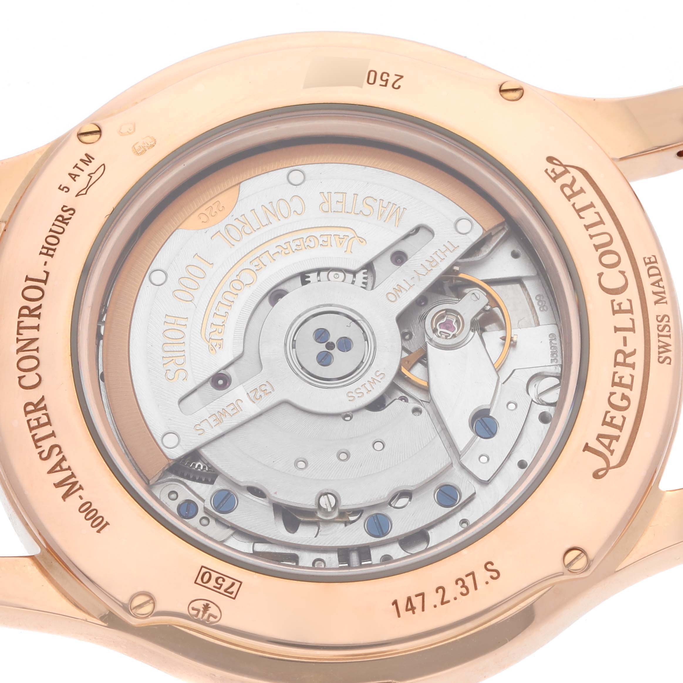 The image shows the back view of a Jaeger-LeCoultre Master watch, highlighting its mechanical movement.