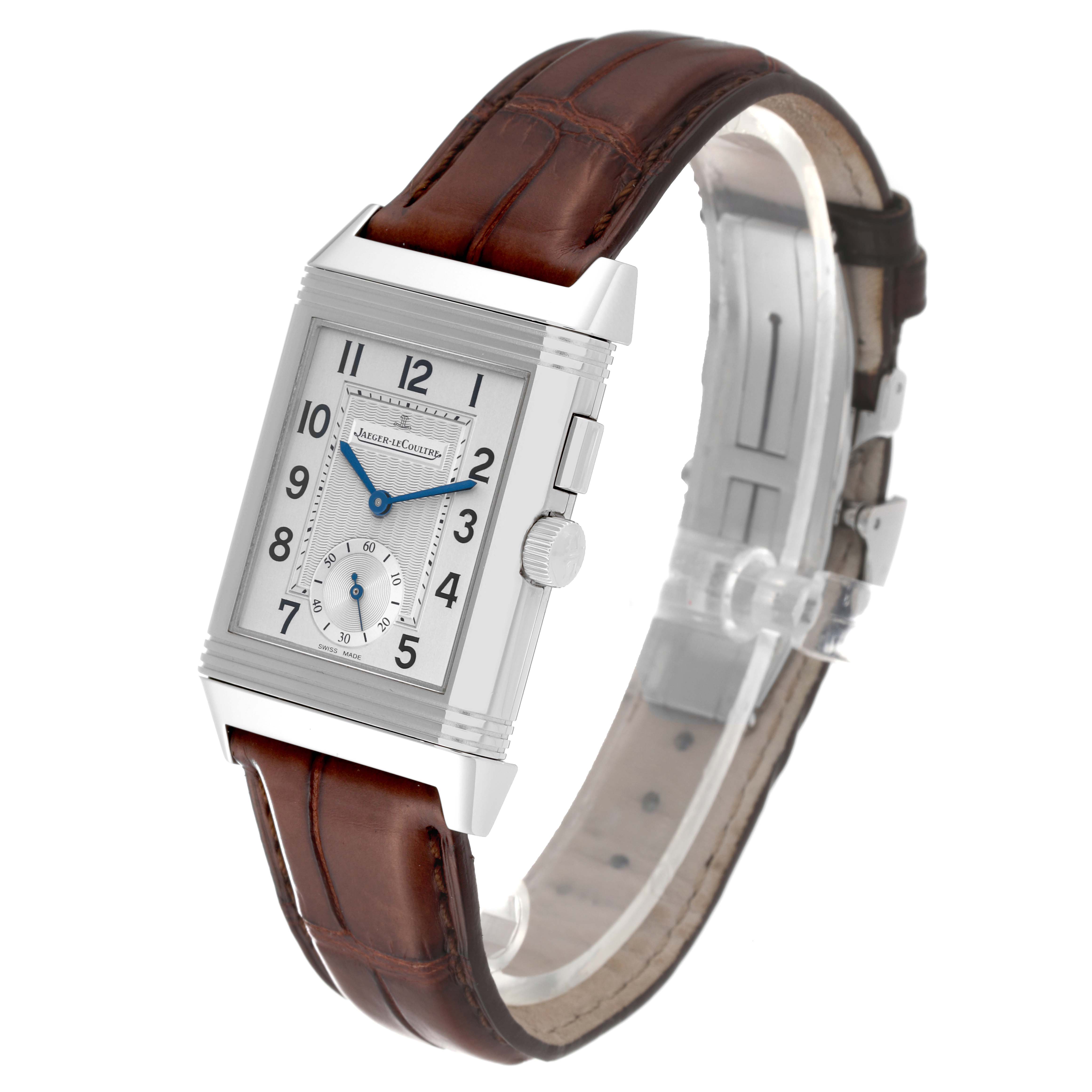 The image shows a Jaeger LeCoultre Reverso Q2718410 Men
s Stainless Steel Silver Dial Q2718410 Men
s Stainless Steel Silver Dial watch at a slight angle, displaying the face, crown, and brown leather strap.