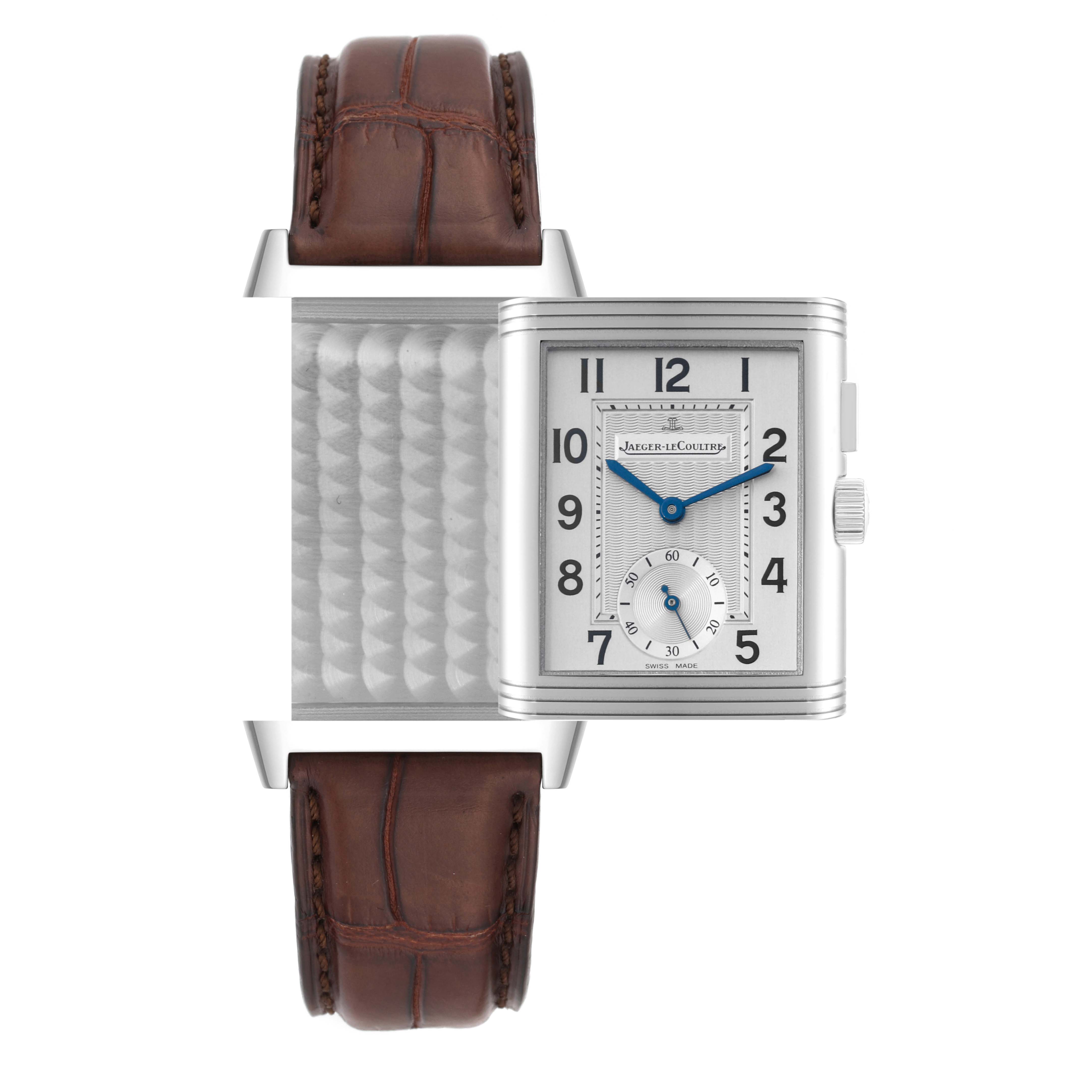 The Jaeger LeCoultre Reverso Q2718410 Men
s Stainless Steel Silver Dial Q2718410 Men
s Stainless Steel Silver Dial watch is shown with its face flipped to the side, revealing the detailed case back and brown leather strap.