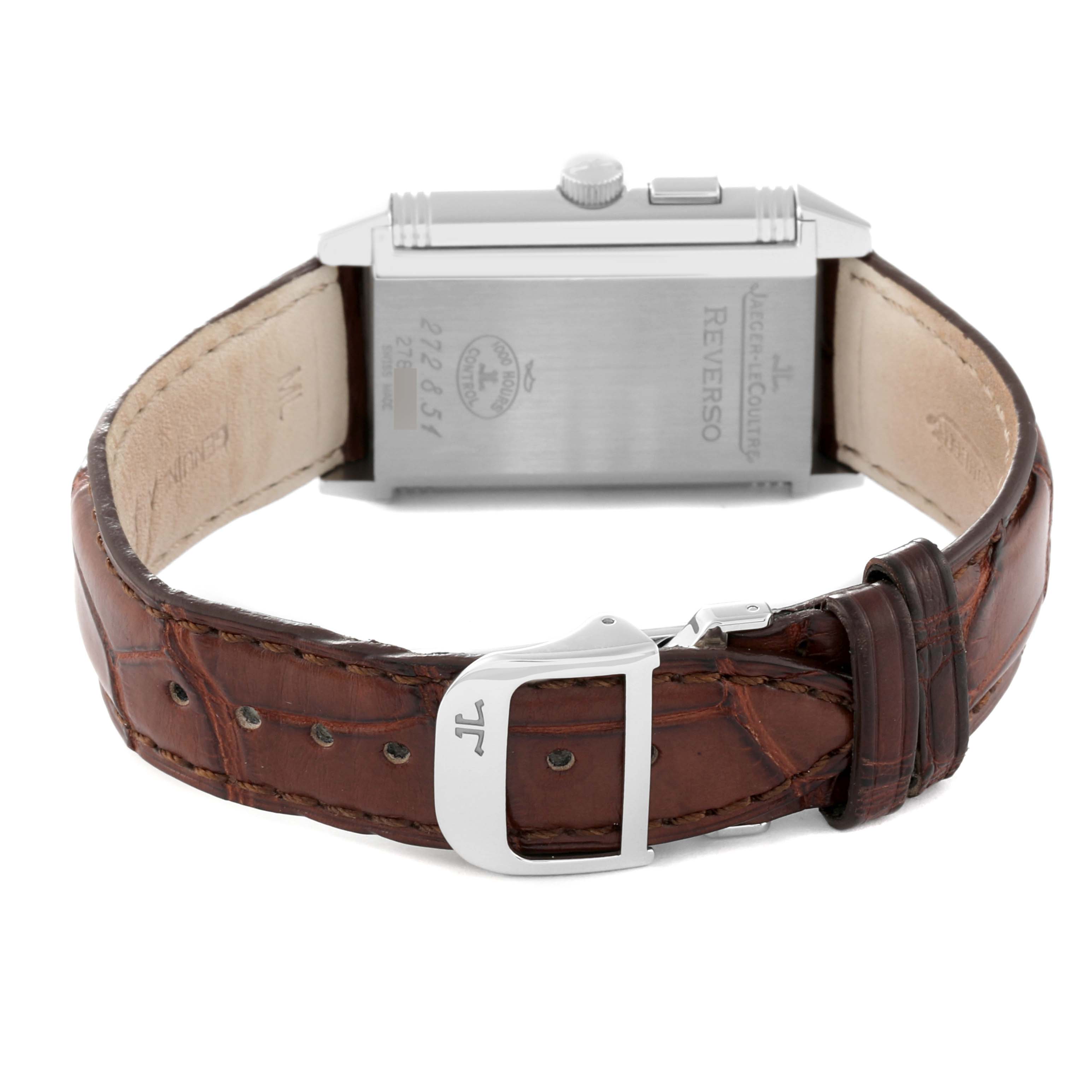 The image shows the back view of a Jaeger-LeCoultre Reverso watch, emphasizing the leather strap, buckle, and case back details.