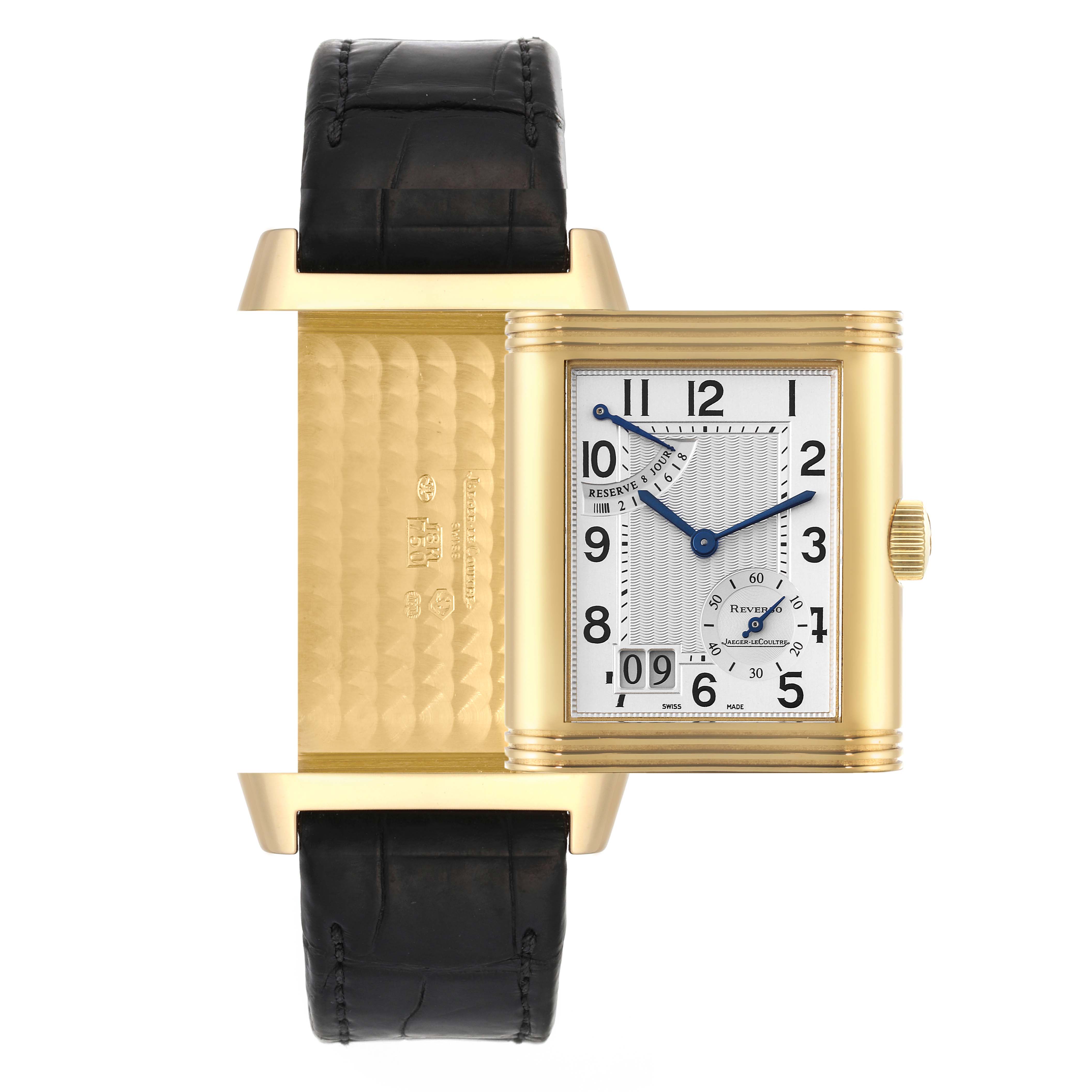 The image shows the Jaeger LeCoultre Reverso Q3001420 Men's Yellow Gold Silver Dial Q3001420 Men's Yellow Gold Silver Dial watch with its case swiveled open, revealing the gold back and inner engravings.