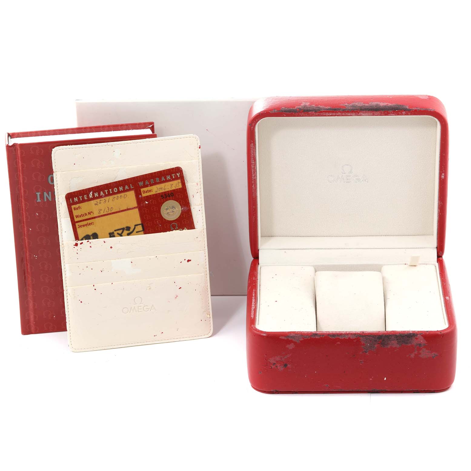 The image shows a red Omega Seamaster 2531.80.00 Men's Stainless Steel Blue Dial 2531.80.00 Men's Stainless Steel Blue Dial watch box, an international warranty card, and an instruction manual.