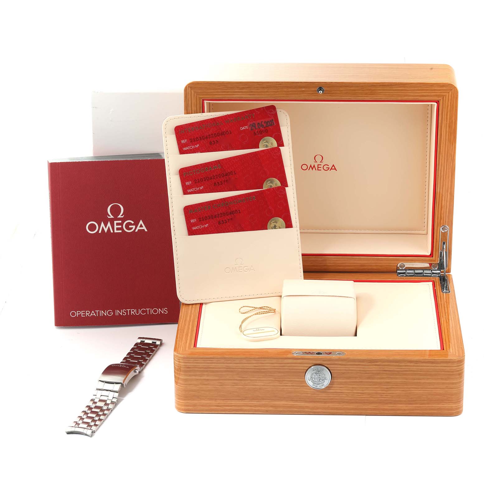 The image shows an Omega Seamaster 210.30.42.20.04.001 Men
s Stainless Steel White Dial 210.30.42.20.04.001 Men
s Stainless Steel White Dial watch box with operating instructions, warranty cards, and a spare metal bracelet.