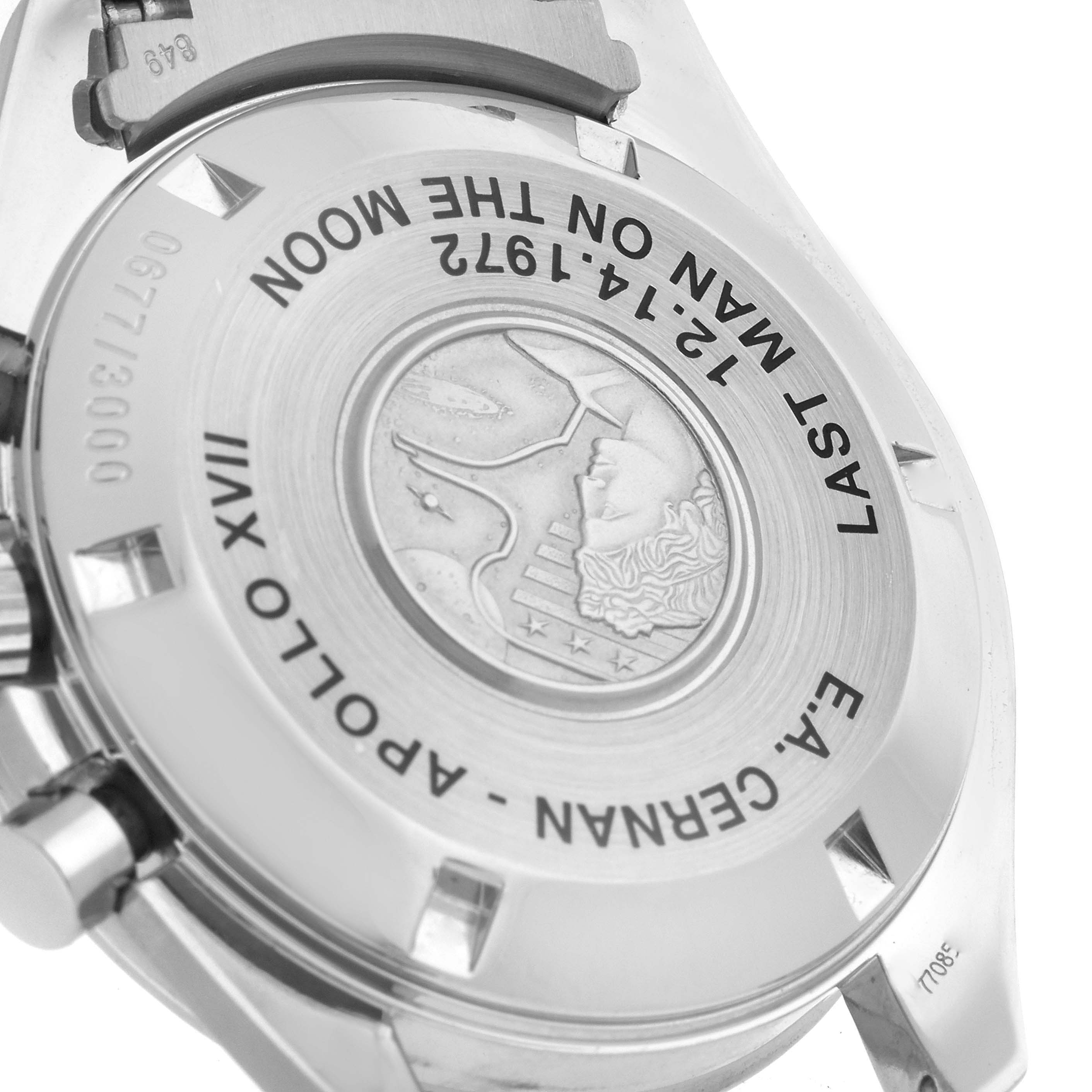 The image shows the back case and clasp of an Omega Speedmaster 3574.51.00 Men's Stainless Steel Black Dial 3574.51.00 Men's Stainless Steel Black Dial, highlighting the engraved details.