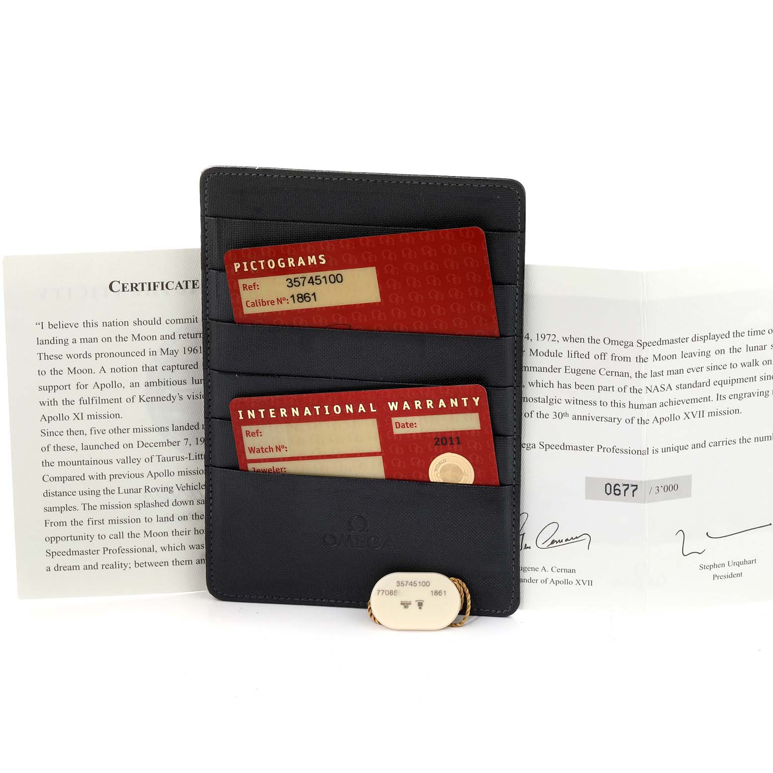 This image features Omega Speedmaster 3574.51.00 Men's Stainless Steel Black Dial 3574.51.00 Men's Stainless Steel Black Dial model accessories, including warranty cards, a certificate, and a cardholder, viewed from the front.