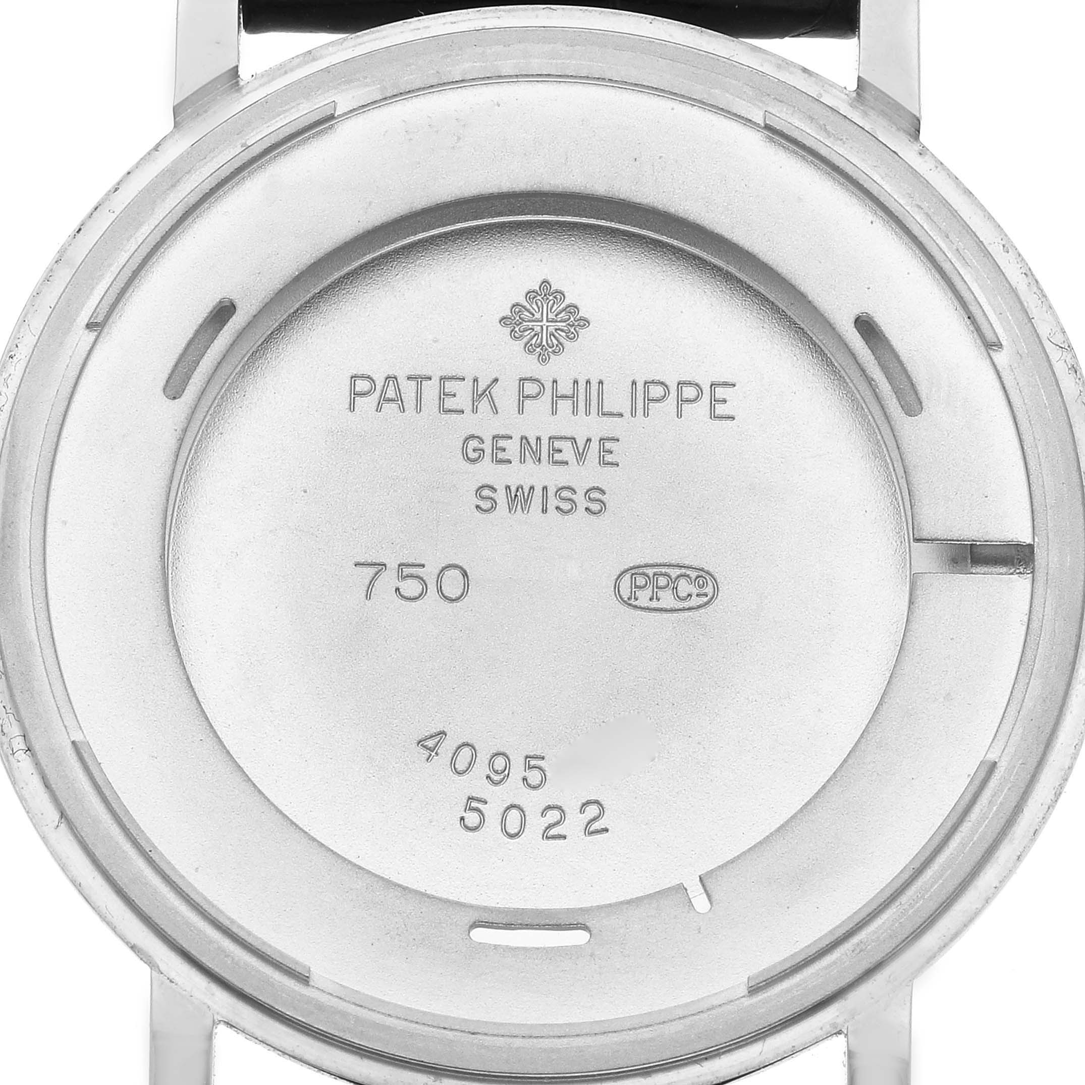 The image shows the back casing of a Patek Philippe Calatrava 5022G Men's White Gold Black Dial 5022G Men's White Gold Black Dial watch, focusing on the internal markings.