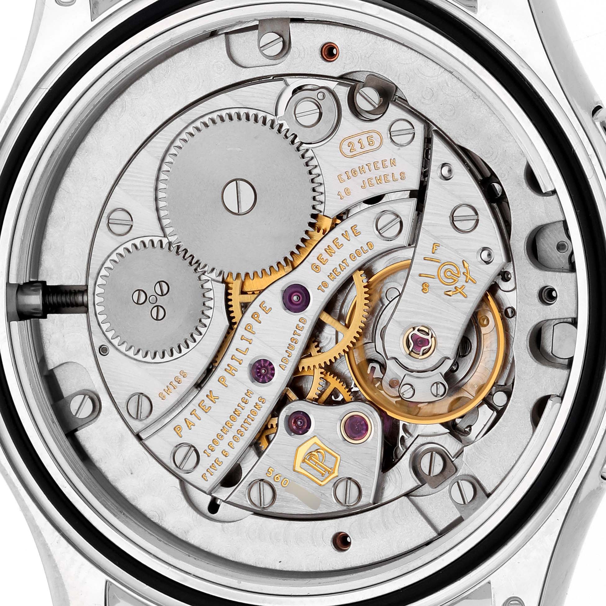 This image shows the intricate movement and internal gears of a Patek Philippe Calatrava 4934G-001 Women's White Gold Mother of Pearl Dial 4934G-001 Women's White Gold Mother of Pearl Dial watch from a rear angle.