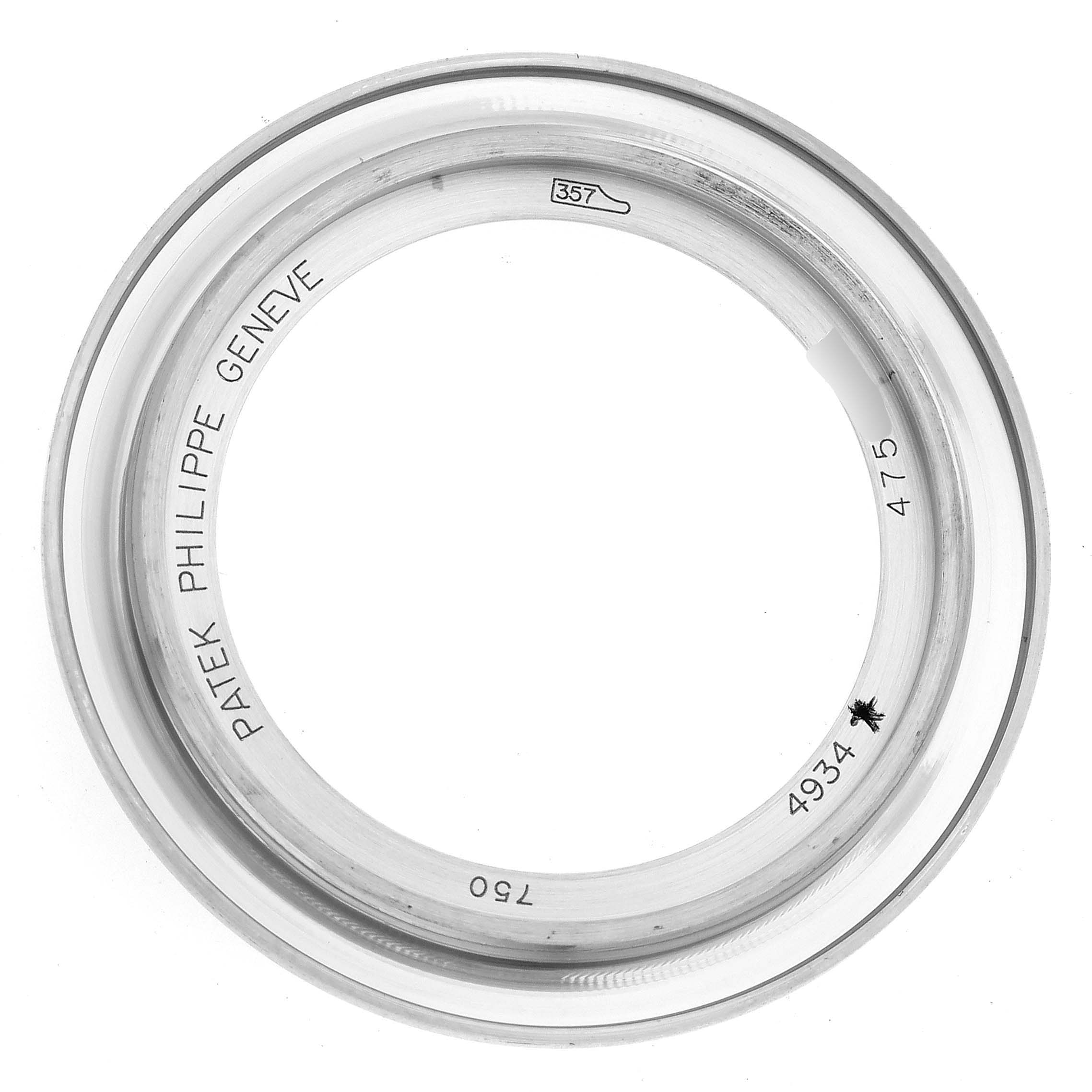 The image shows a close-up of the bezel for the Patek Philippe Calatrava 4934G-001 Women's White Gold Mother of Pearl Dial 4934G-001 Women's White Gold Mother of Pearl Dial watch model.