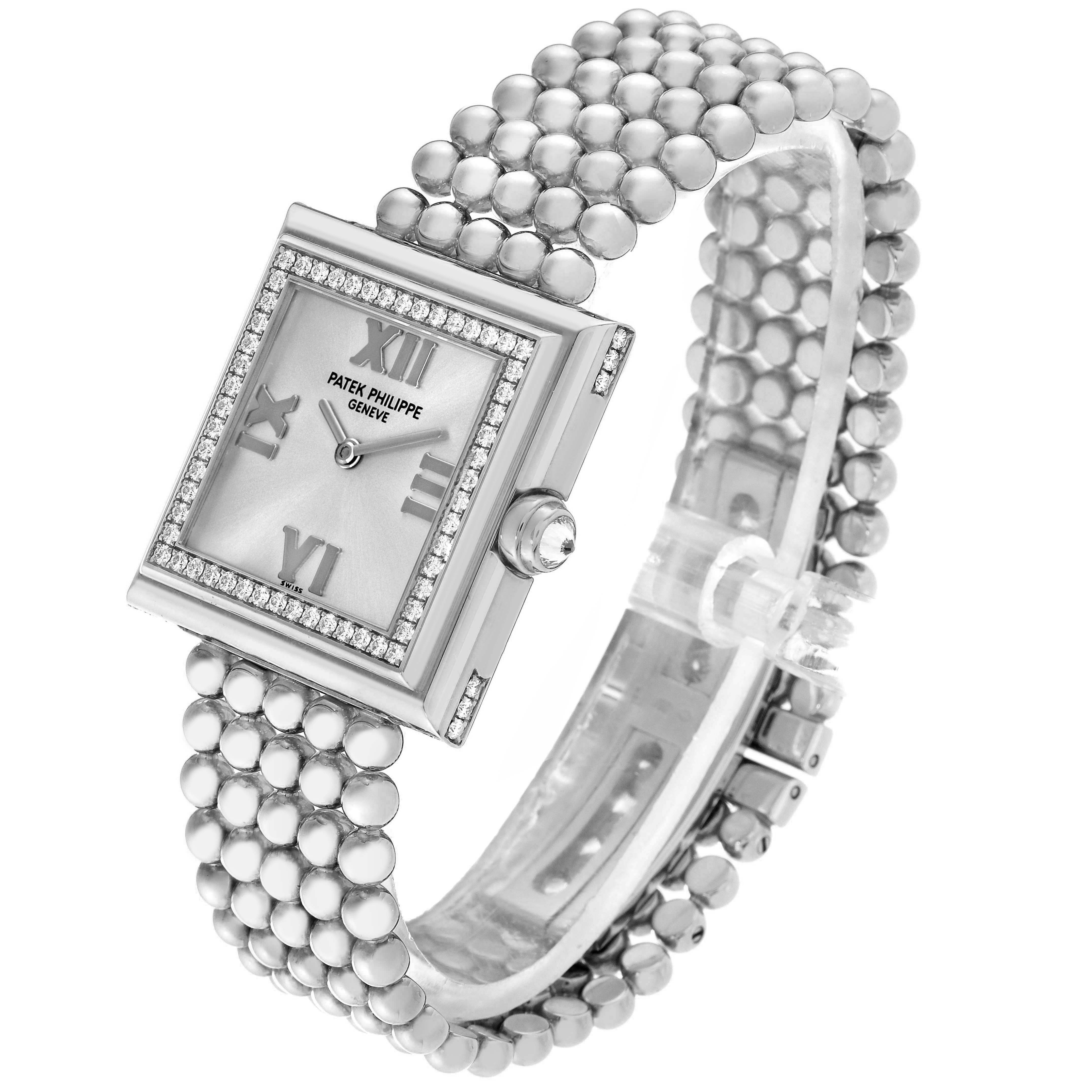 The Patek Philippe Gondolo 4868/001 Women's White Gold White Dial 4868/001 Women's White Gold White Dial watch is shown at an angle highlighting the face, diamond-set bezel, and beaded bracelet.