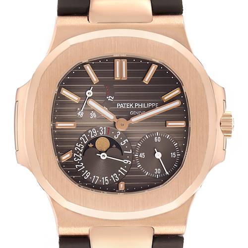 The Patek Philippe Nautilus 5712R-001 Men's Rose Gold Brown Dial watch is shown front-facing, displaying the dial, hands, subdials, and leather strap connection.