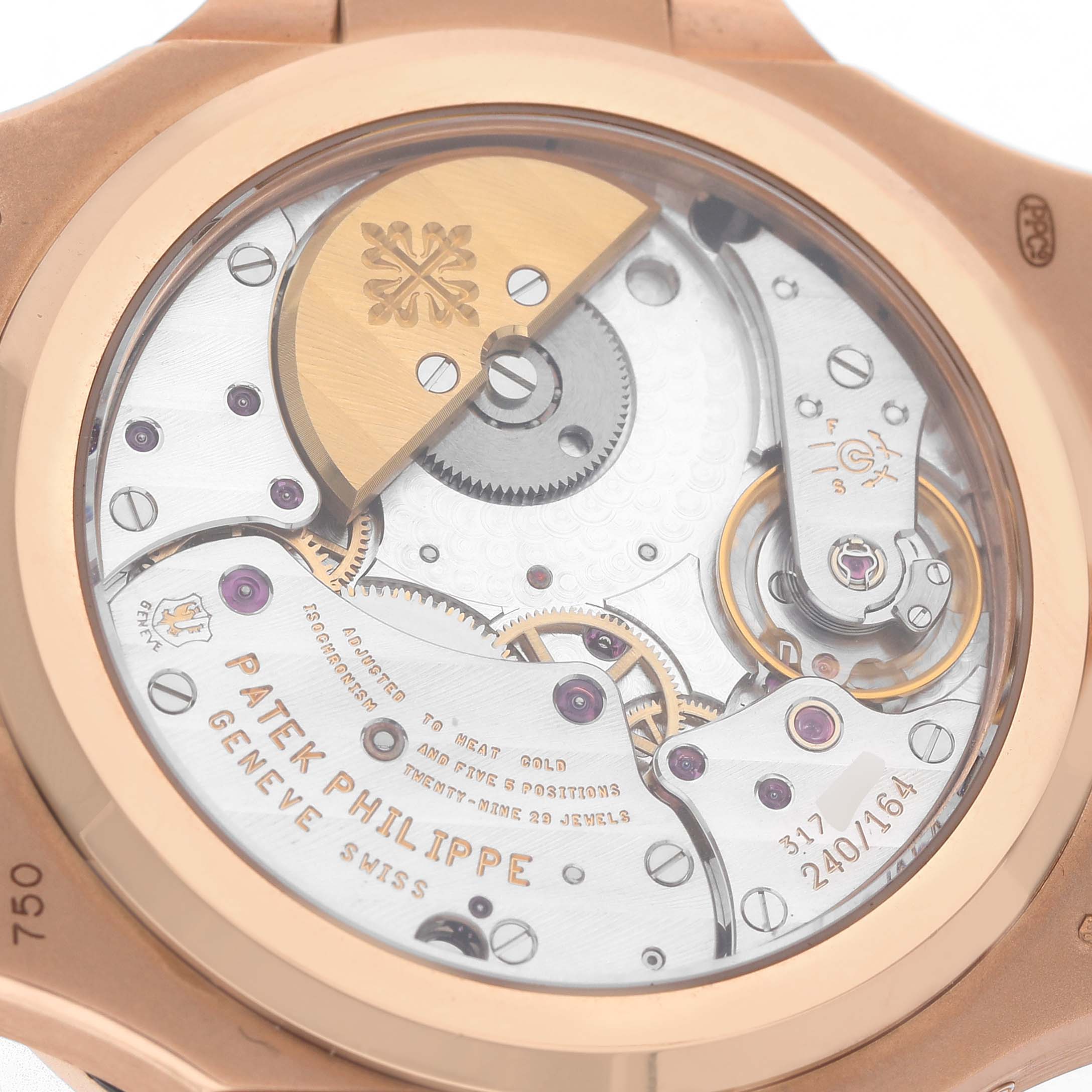 The image shows the back view of a Patek Philippe Nautilus 5712R-001 Men's Rose Gold Brown Dial, highlighting its intricate mechanical movement.
