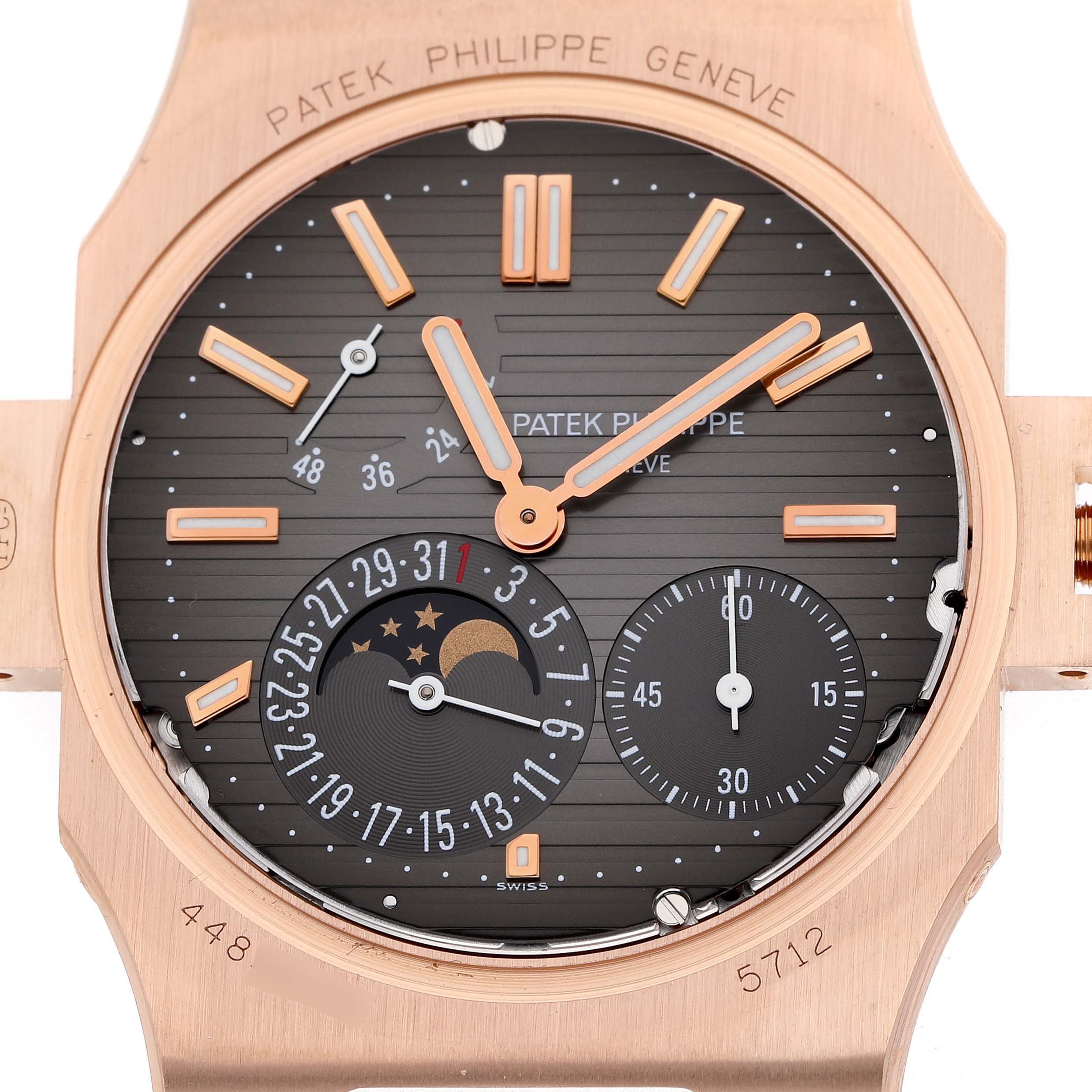 The image shows a close-up front view of the Patek Philippe Nautilus 5712R-001 Men's Rose Gold Brown Dial watch face, highlighting its dial and complications.