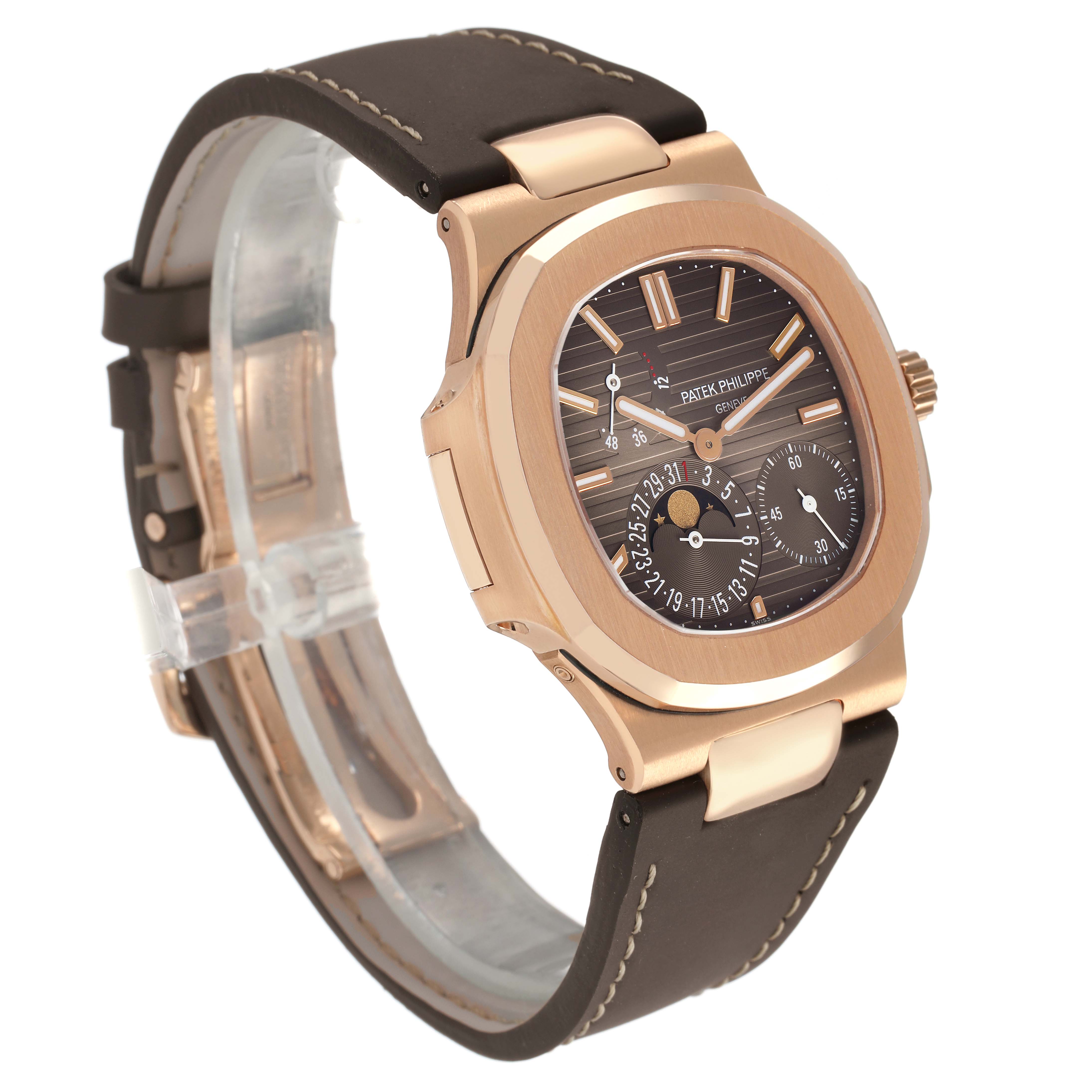 The Patek Philippe Nautilus 5712R-001 Men's Rose Gold Brown Dial watch is shown from a three-quarter angle, displaying the face, case, and strap.