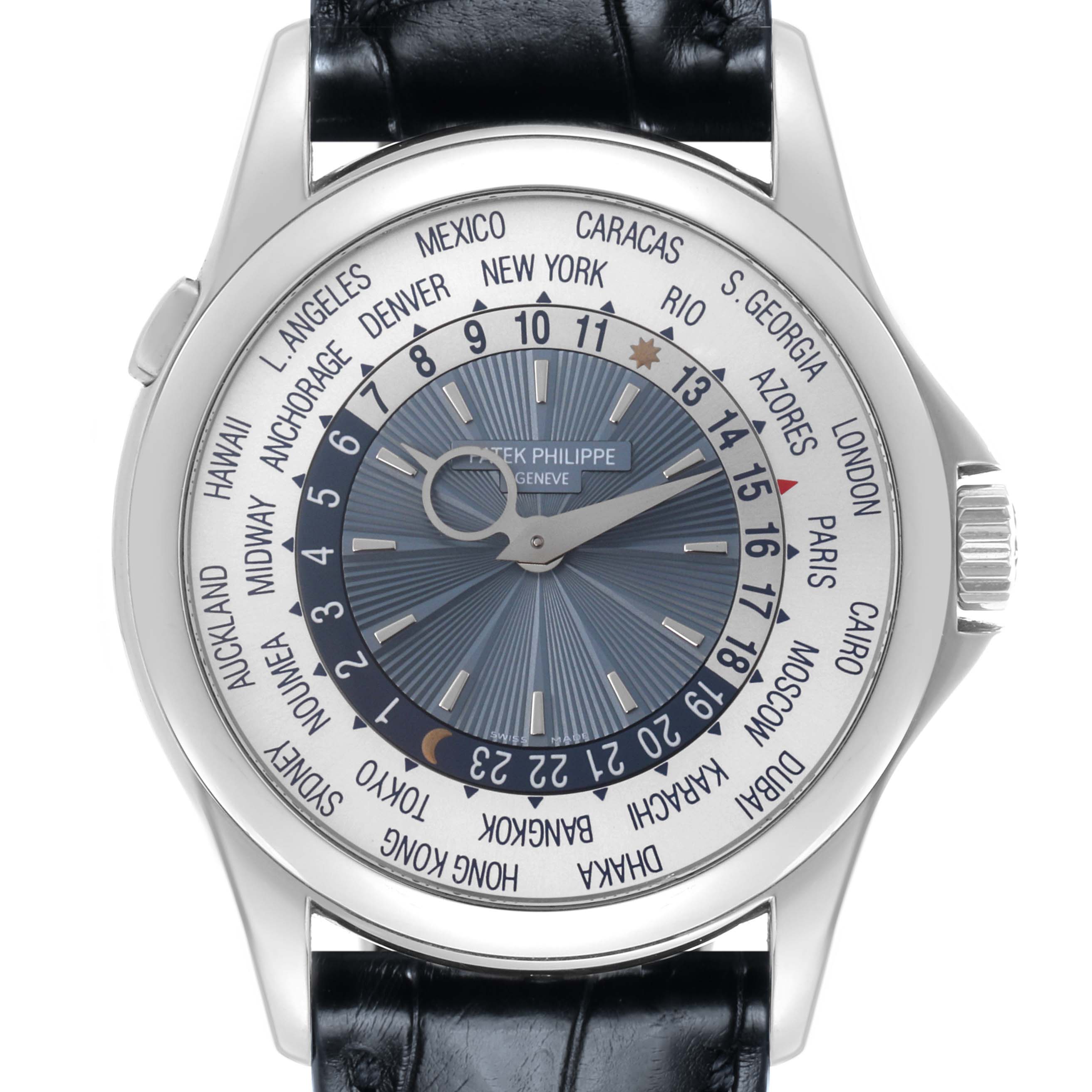 The image shows a front view of the Patek Philippe Complications 5130P-001 Men's Platinum Silver Dial 5130P-001 Men's Platinum Silver Dial watch, displaying its world time dial and city names.