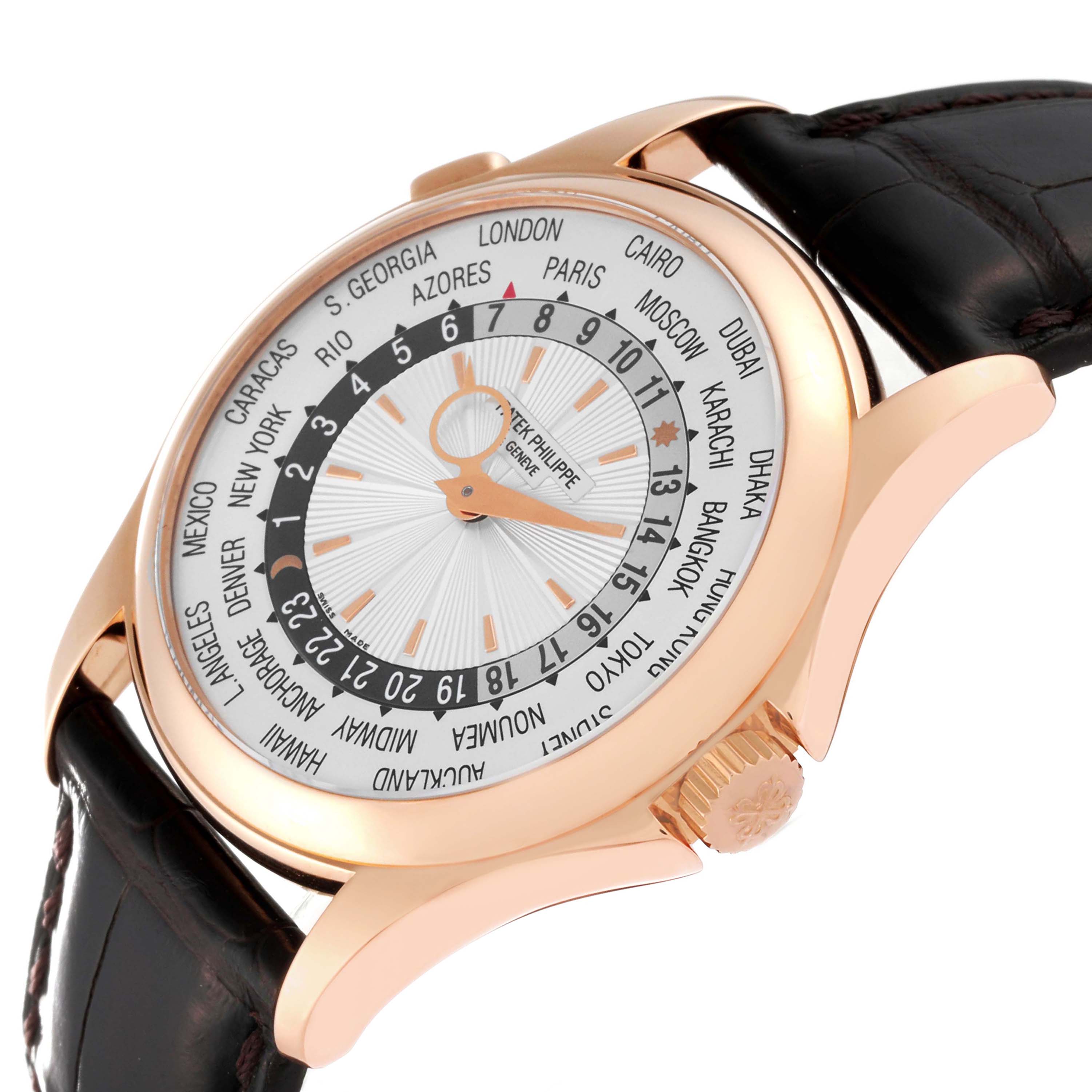 The image shows a Patek Philippe Complications 5130R-001 Men
s Rose Gold Silver Dial 5130R-001 Men
s Rose Gold Silver Dial model watch at an angled view, highlighting the face, bezel, crown, and part of the leather strap.