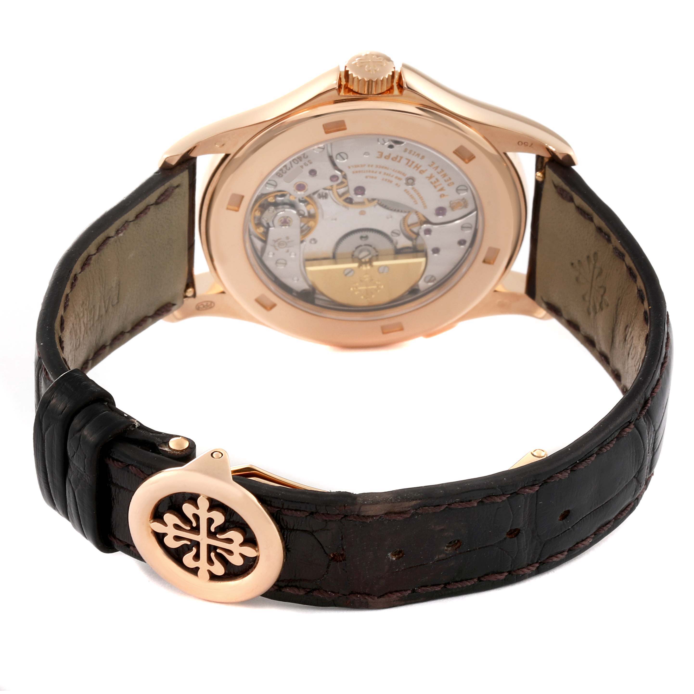 This image shows the rear view of a Patek Philippe Complications 5130R-001 Men
s Rose Gold Silver Dial 5130R-001 Men
s Rose Gold Silver Dial watch, highlighting its open case back and leather strap.