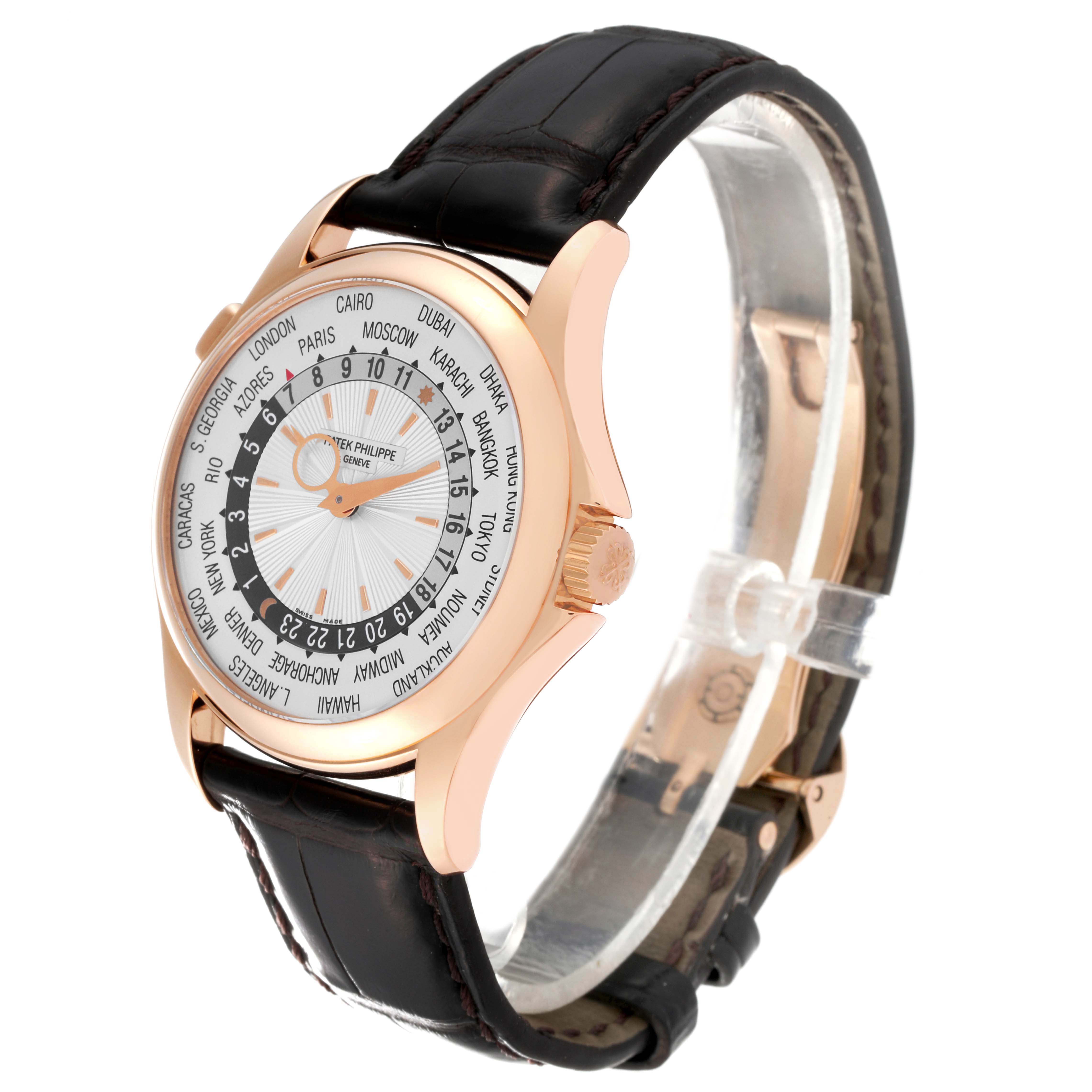 The image shows a side angle of the Patek Philippe Complications 5130R-001 Men
s Rose Gold Silver Dial 5130R-001 Men
s Rose Gold Silver Dial watch, highlighting its face, dial, and leather strap.