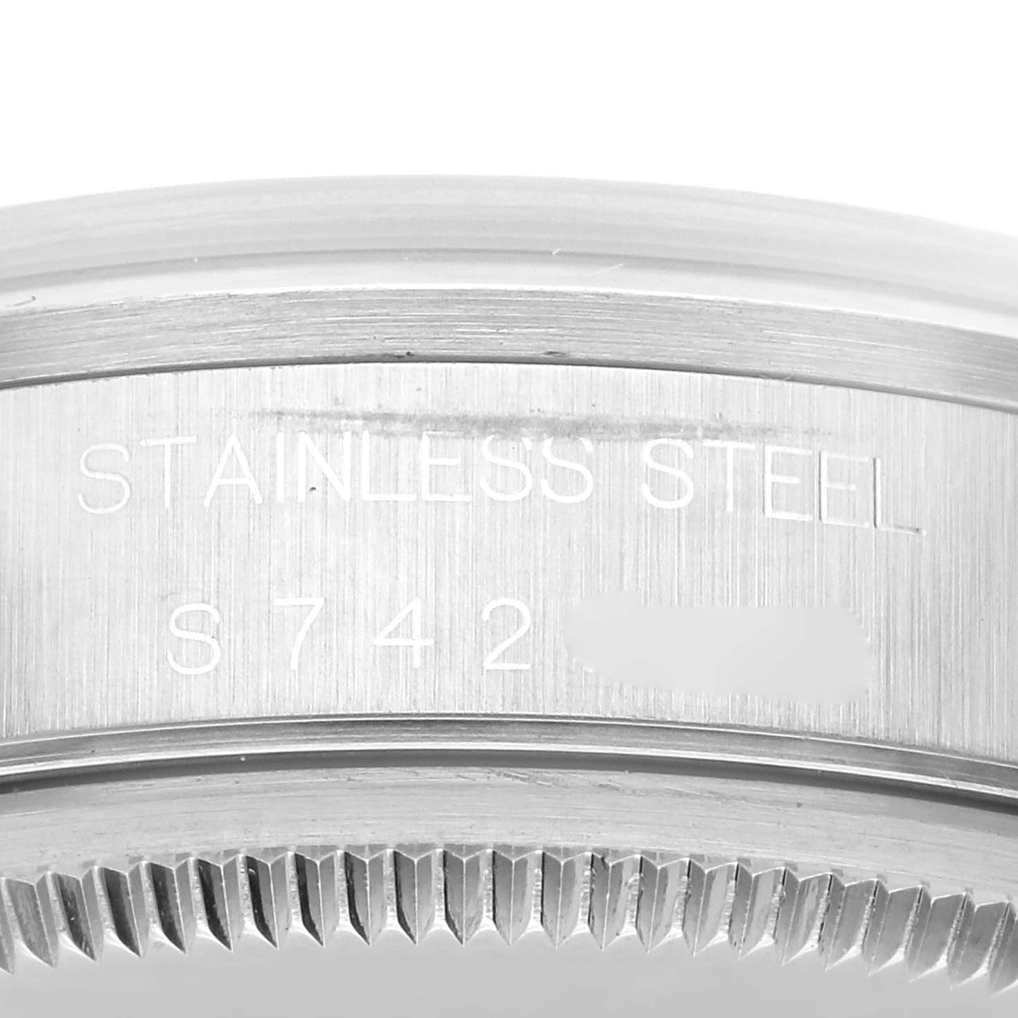 The image shows a close-up of the caseback edge, with "stainless steel" and serial number details of a Rolex Air-King 14000 Men's Stainless Steel White Dial 14000 Men's Stainless Steel White Dial watch.