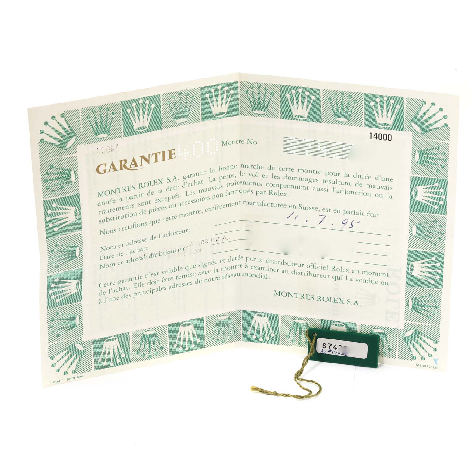 This image shows the warranty card and tag for the Air-King model by Rolex from a front angle.