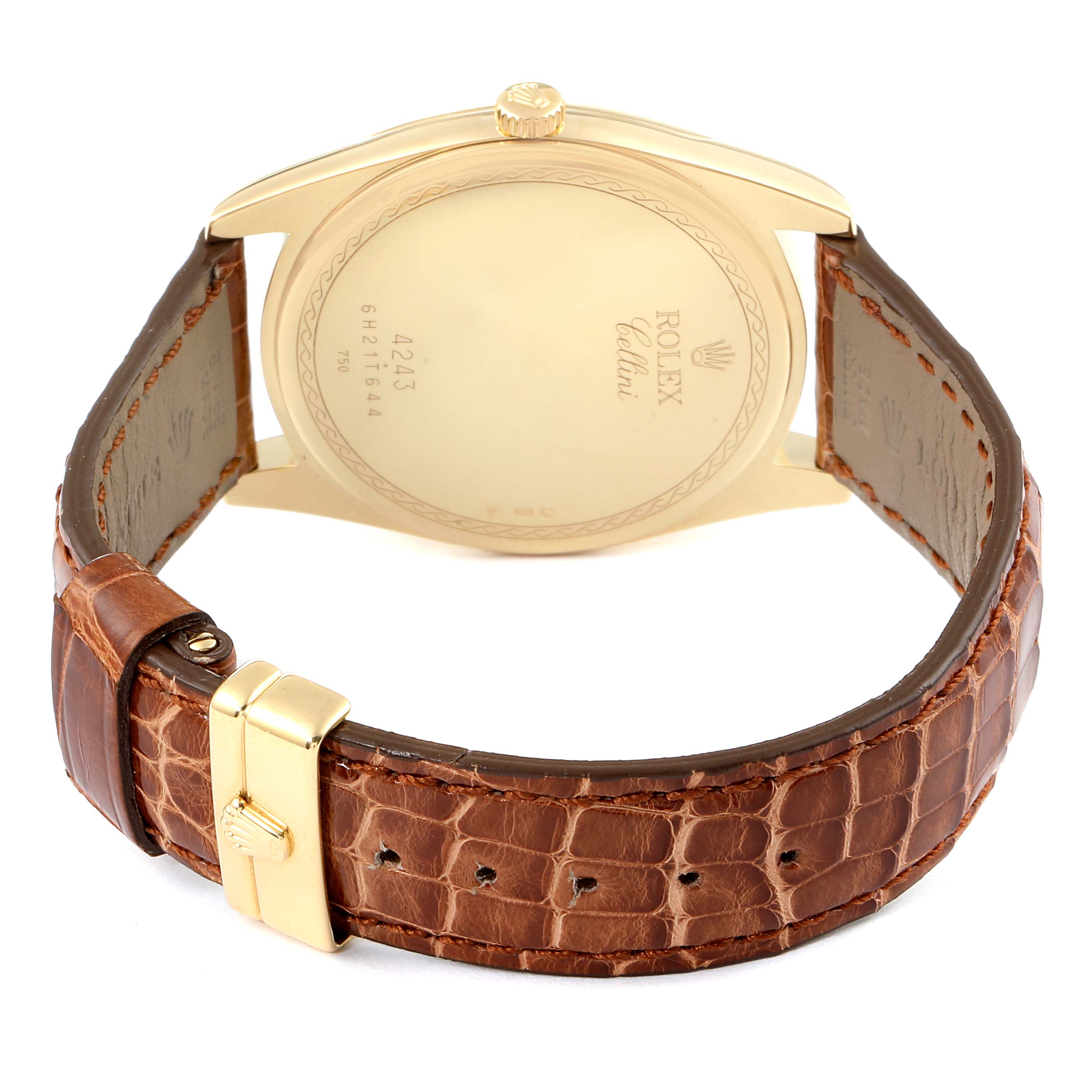 The image shows the back view of a Rolex Cellini 4243 Men's Yellow Gold Champagne Dial 4243 Men's Yellow Gold Champagne Dial watch, featuring its case back, crown, and brown leather strap with a buckle.
