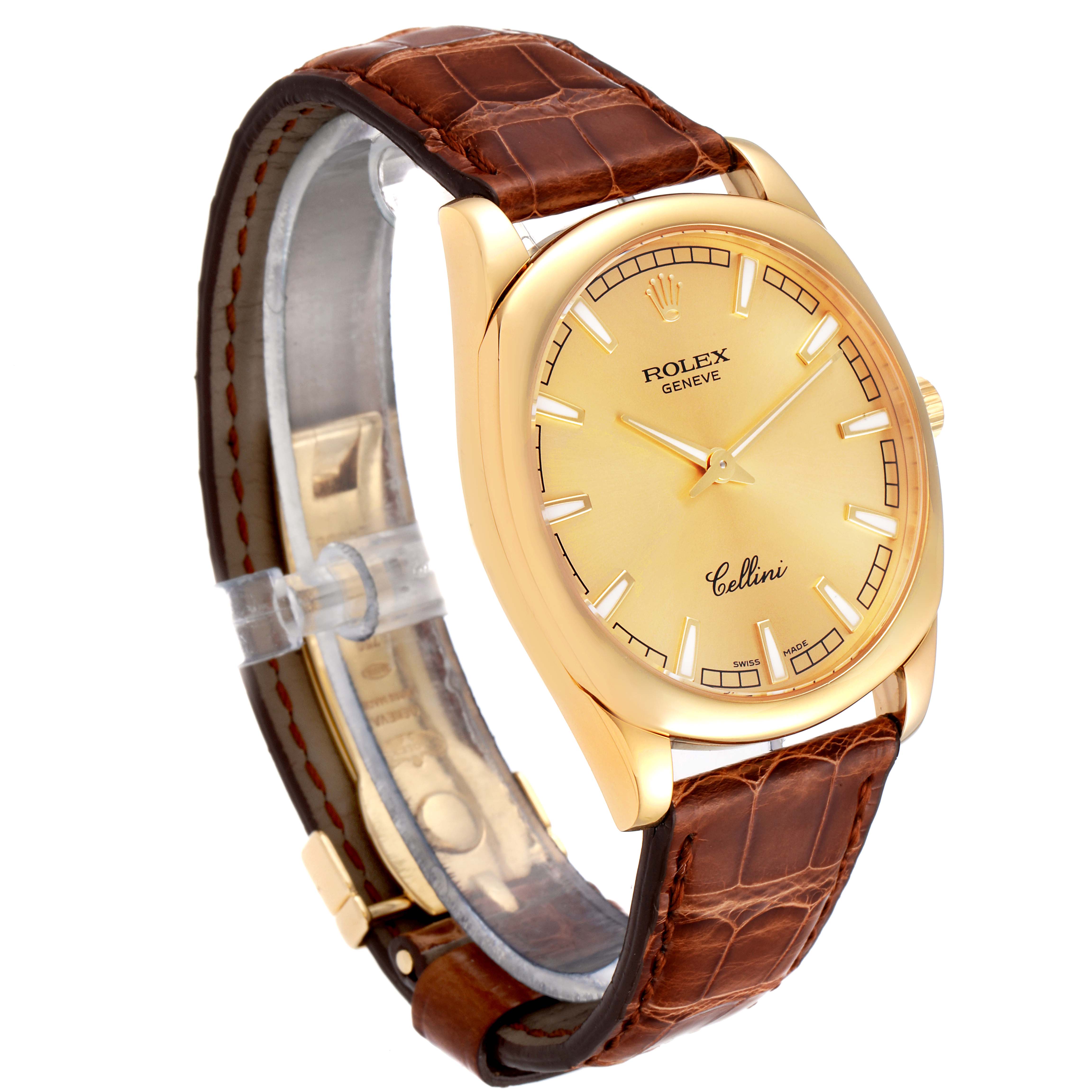 The image shows a Rolex Cellini 4243 Men's Yellow Gold Champagne Dial 4243 Men's Yellow Gold Champagne Dial watch at an oblique angle, highlighting its face, bezel, and brown leather strap.