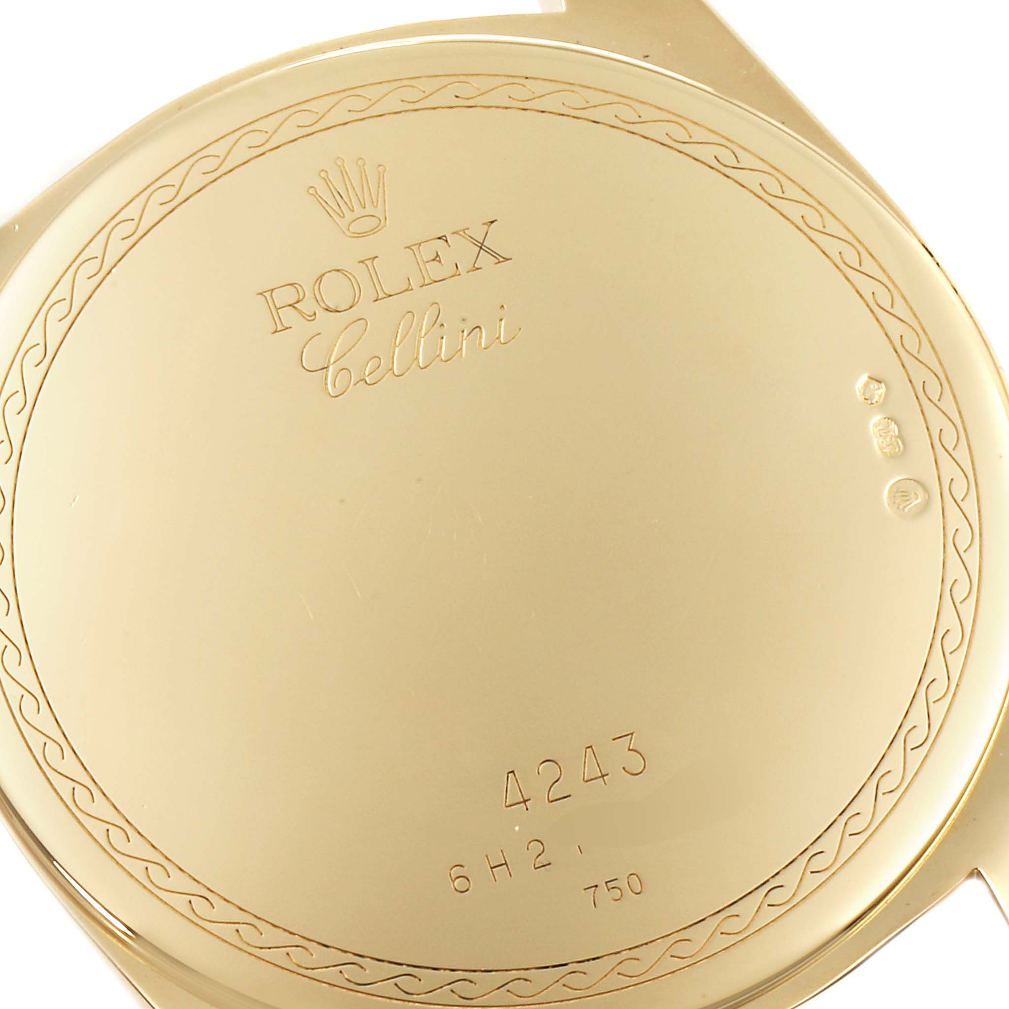 This image shows the back case of a Rolex Cellini 4243 Men's Yellow Gold Champagne Dial 4243 Men's Yellow Gold Champagne Dial watch, highlighting the engraved details and serial number.