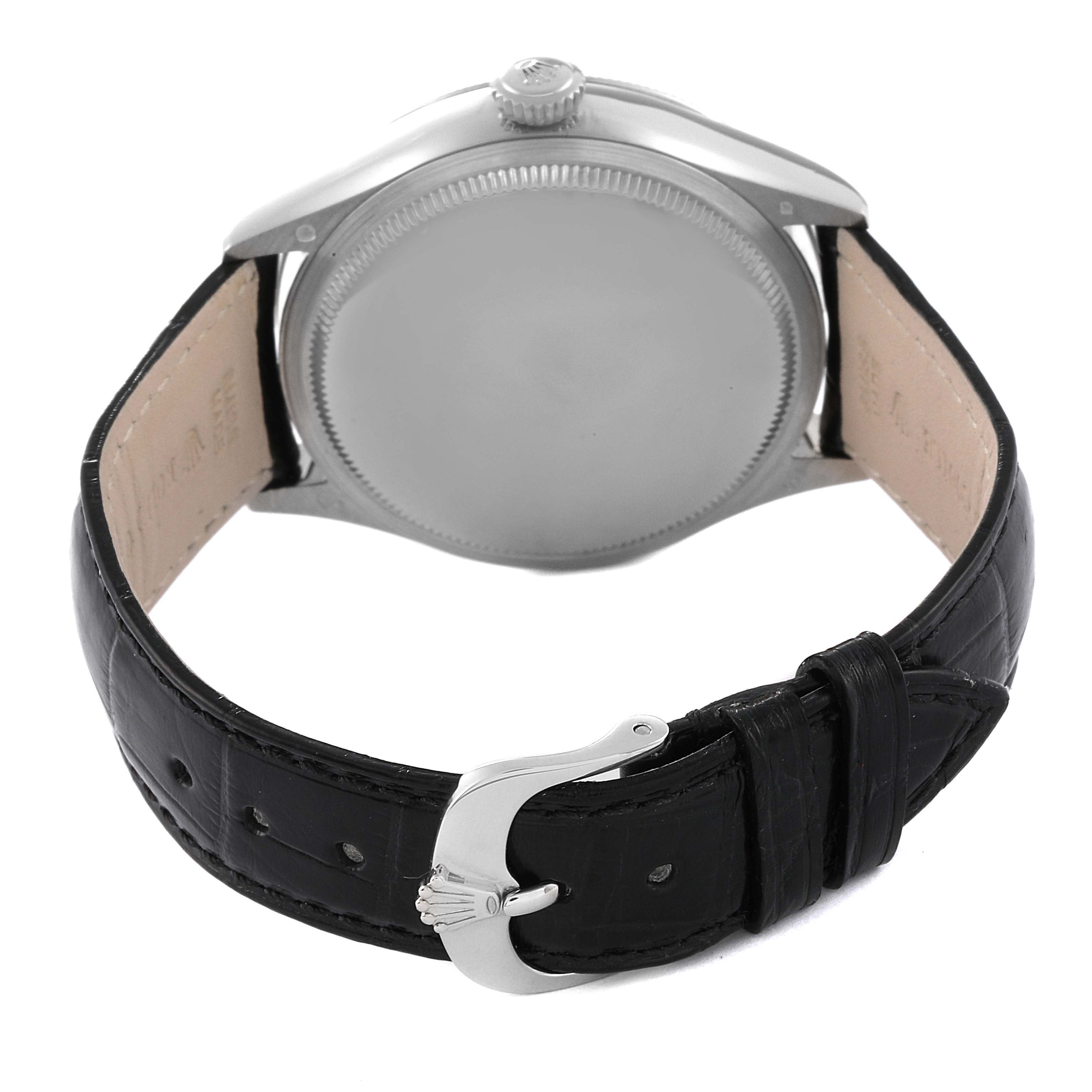 The image shows the back case, crown, and black leather strap with buckle of a Rolex Cellini 50519 Men's White Gold Silver Dial 50519 Men's White Gold Silver Dial watch.