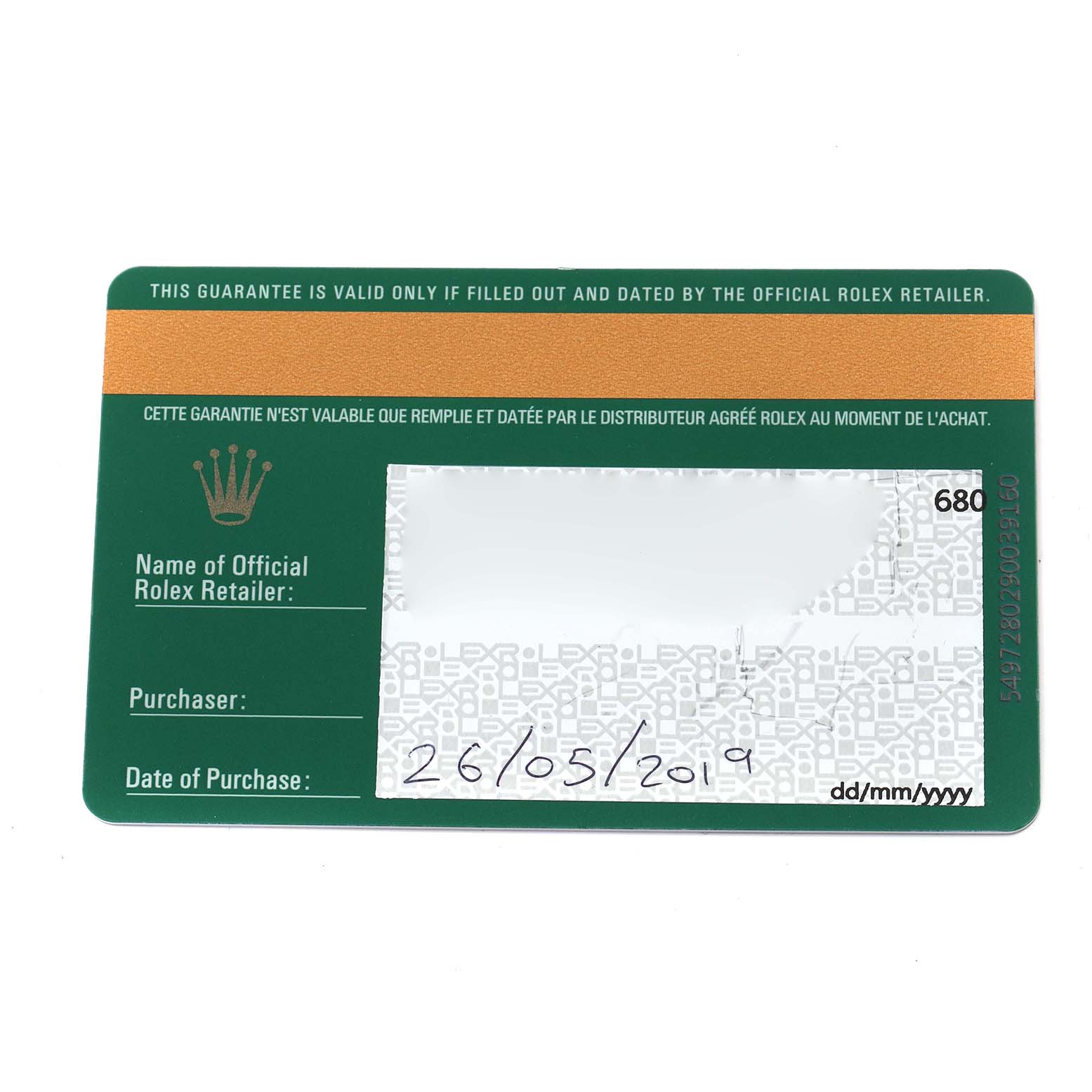 The image shows a Rolex warranty card for a Daytona model, viewed from above.