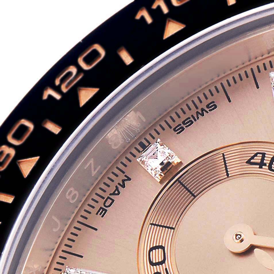 The image shows a close-up of the Rolex Daytona 116515LN Men's Rose Gold Pink Dial 116515LN Men's Rose Gold Pink Dial's bezel and inner dial, highlighting the tachymetric scale and diamond markers.