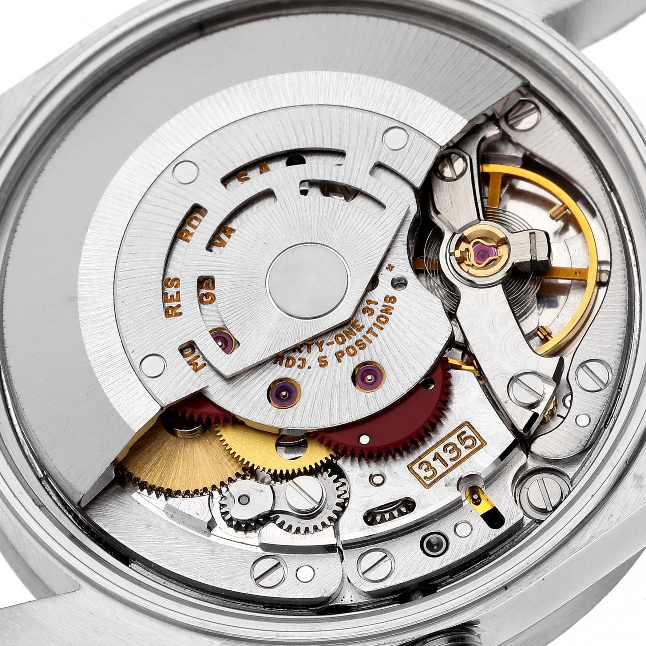 This image shows the intricate movement mechanism of a Rolex Date 15210 Men's Stainless Steel Blue Dial 15210 Men's Stainless Steel Blue Dial model watch from a directly top-down angle.