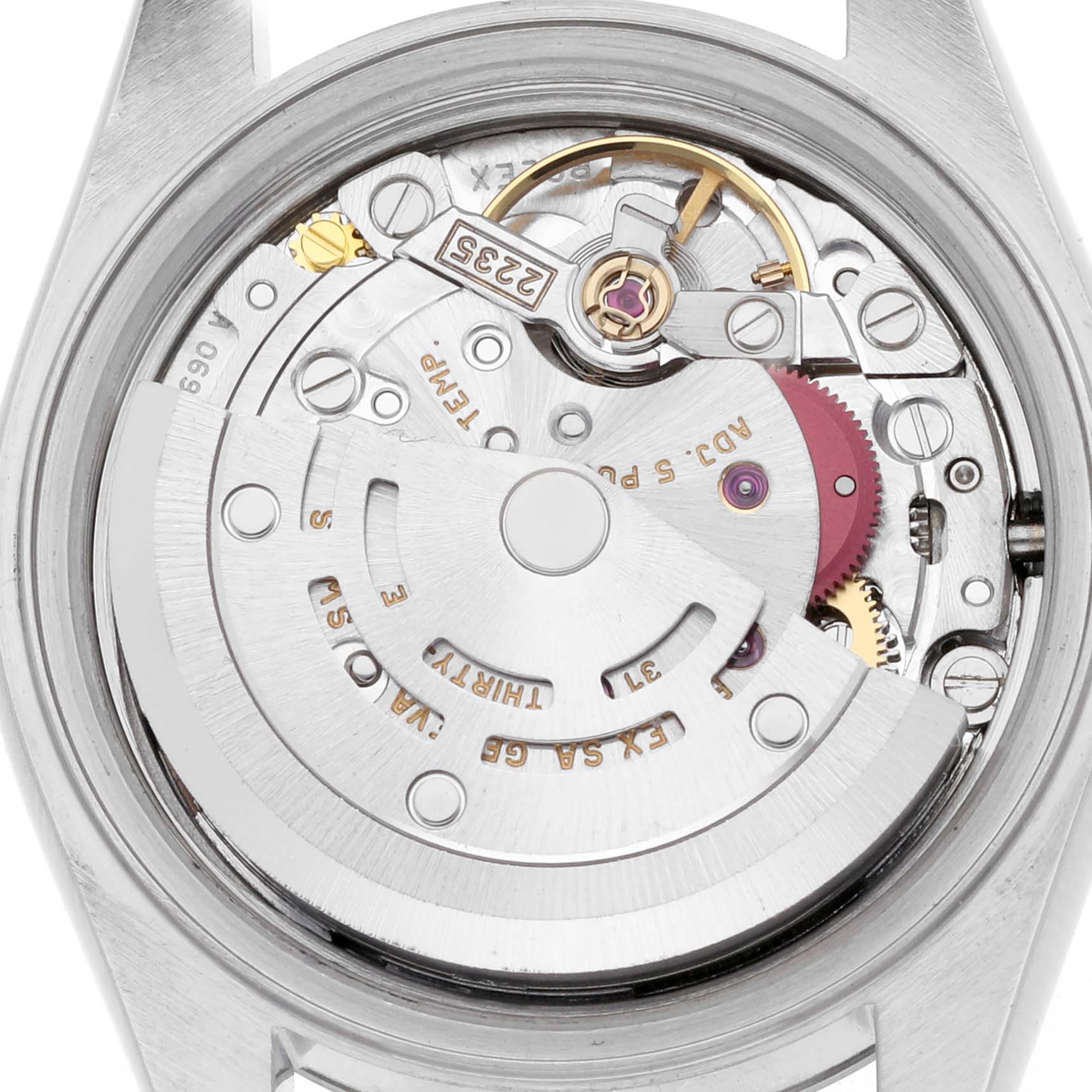 The image shows the movement of a Rolex Date 79190 Women's Stainless Steel Pink Dial 79190 Women's Stainless Steel Pink Dial model watch viewed from the back, highlighting the rotor and gears.