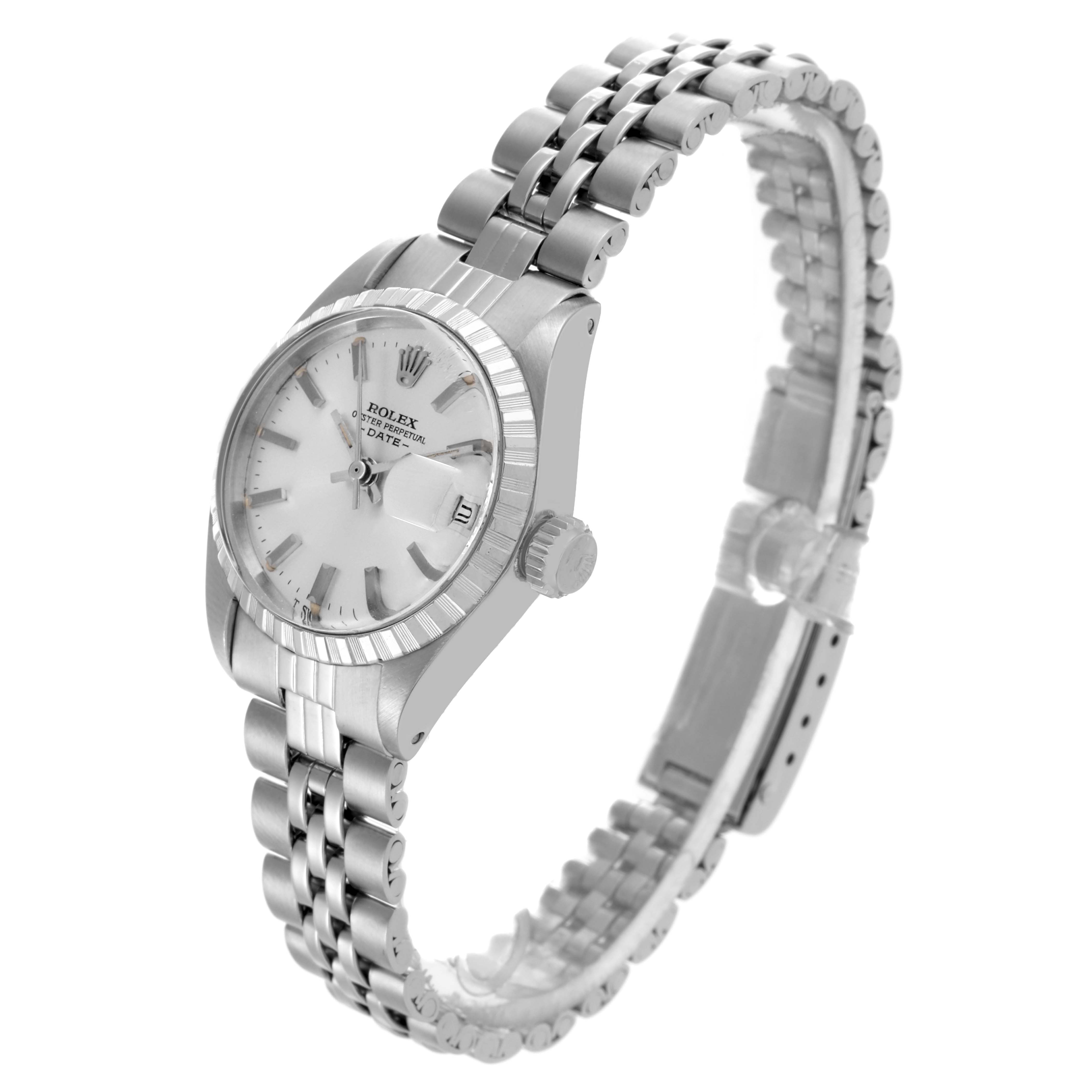 The Rolex Date 6924 Women
s Stainless Steel Silver Dial 6924 Women
s Stainless Steel Silver Dial watch is shown at a side angle, highlighting the case, bracelet, and crown.