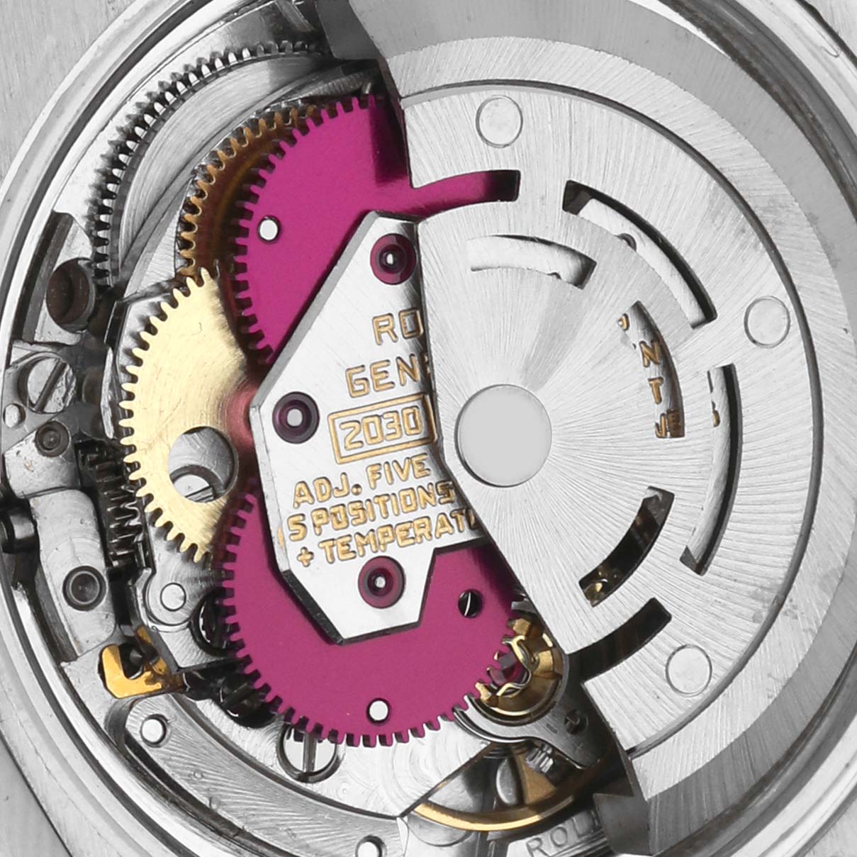 The image shows the movement of a Rolex Date 6924 Women
s Stainless Steel Silver Dial 6924 Women
s Stainless Steel Silver Dial watch, focusing on the gears and rotor at an overhead angle.