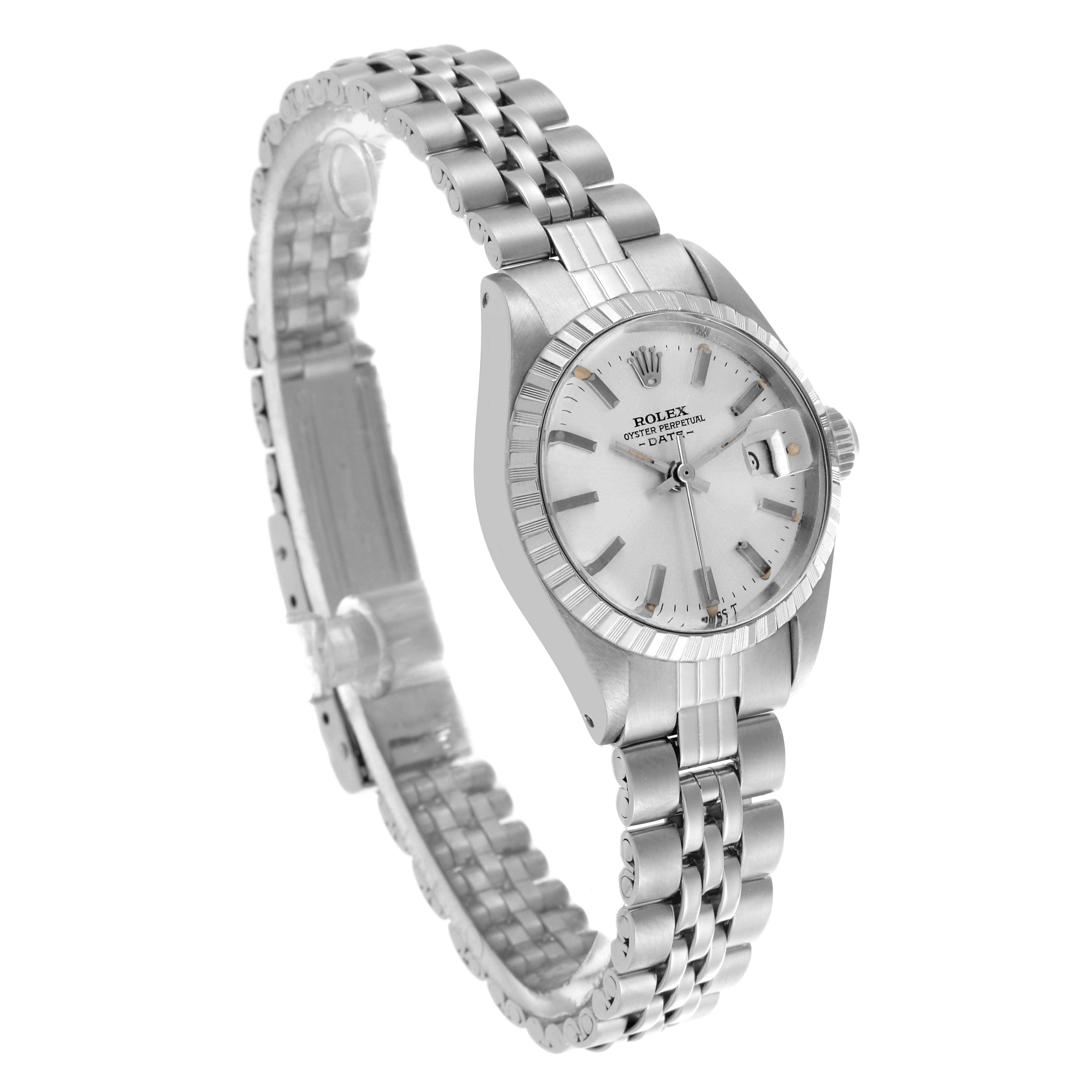 This Rolex Date 6924 Women
s Stainless Steel Silver Dial 6924 Women
s Stainless Steel Silver Dial model watch is shown at a three-quarter angle, highlighting the face, bezel, and bracelet.