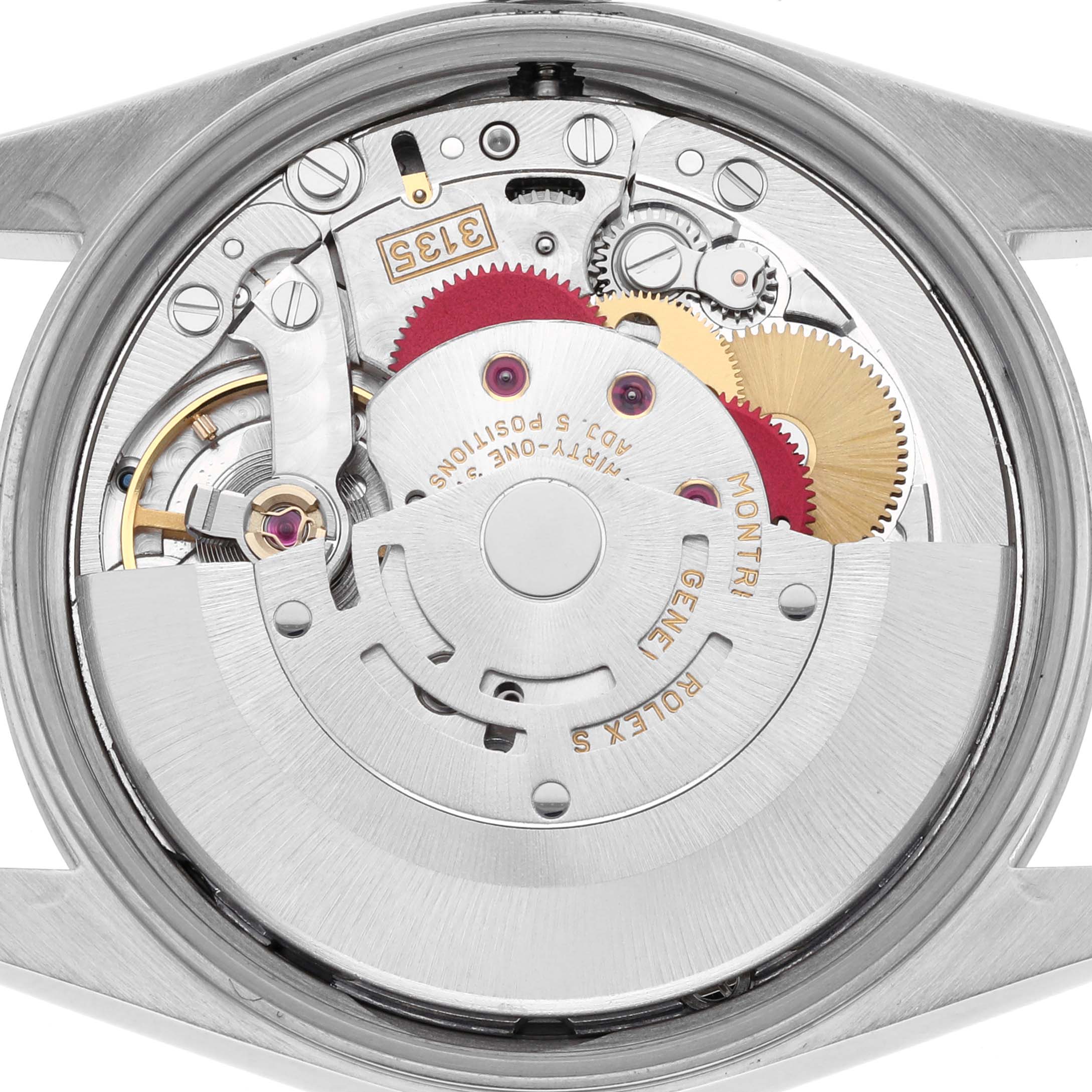 The image shows the movement of a Rolex Date 15200 Men's Stainless Steel Silver Dial 15200 Men's Stainless Steel Silver Dial model from a back view, highlighting gears and internal components.