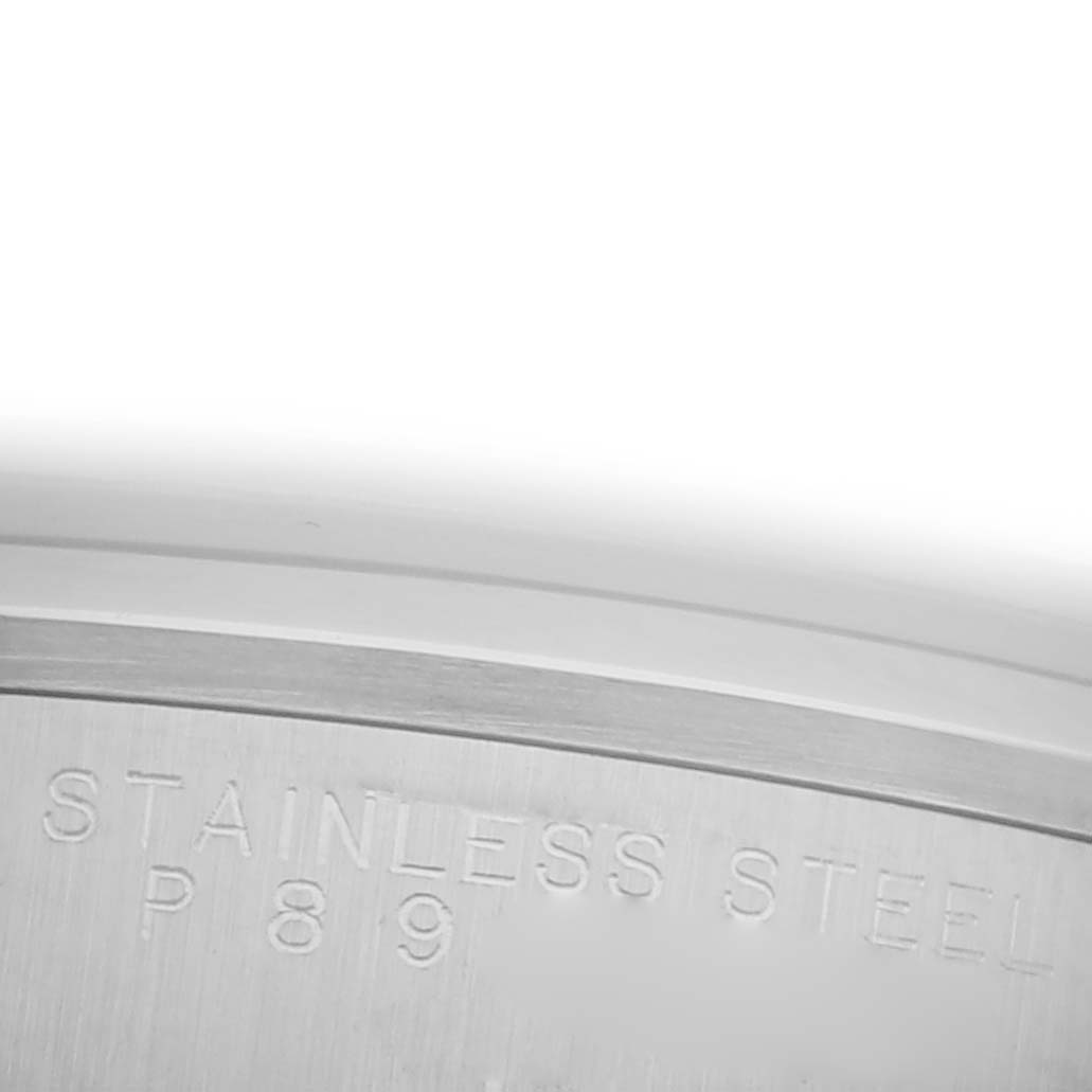 The image shows a close-up of a stainless steel case edge with engravings on a Rolex Date 15200 Men's Stainless Steel Silver Dial 15200 Men's Stainless Steel Silver Dial model watch.