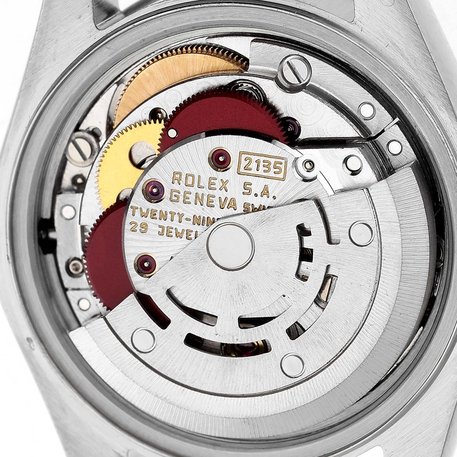 The image shows the movement mechanism of a Rolex Datejust 69173 Women's Steel and Gold (two tone) Champagne Dial, highlighting gears and inscriptions from a rear angle.