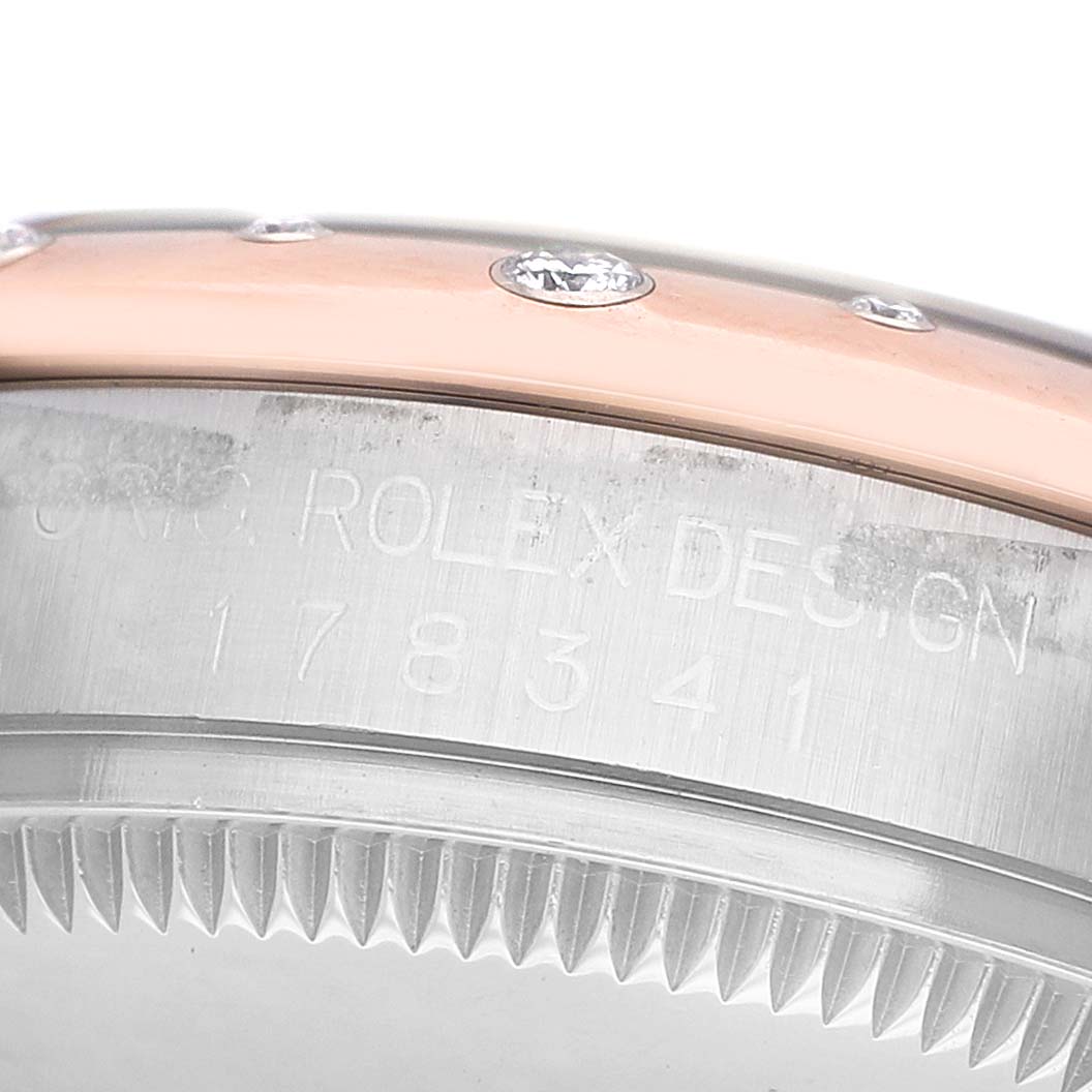 The image shows the side view of a Rolex Datejust 178341 Women's Steel and Gold (two tone) Mother of Pearl Dial bezel with diamond markers and etched model details.