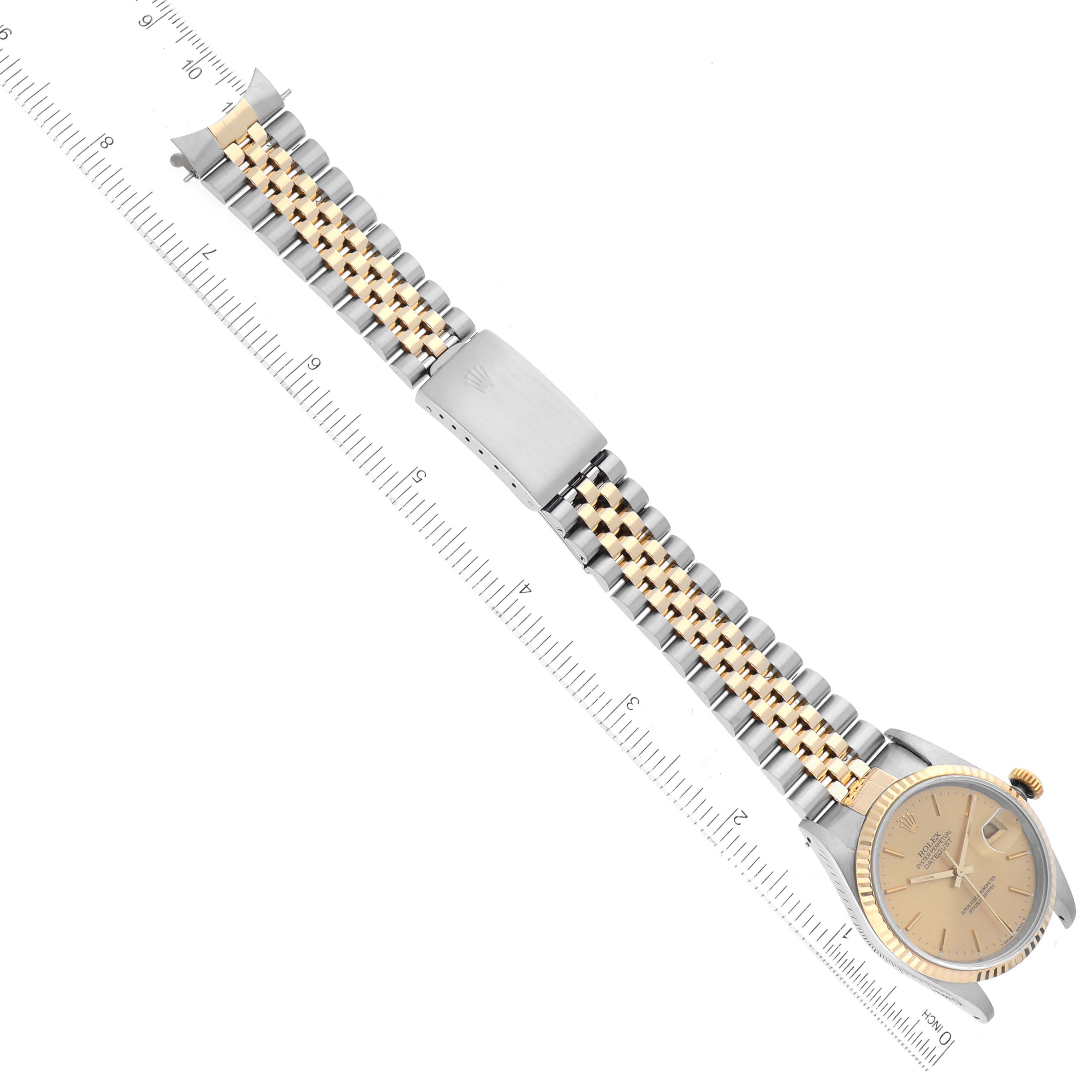 The image shows a Rolex Datejust 16233 Men's Steel and Gold (two tone) Champagne Dial 16233 Men's Steel and Gold (two tone) Champagne Dial watch from an overhead angle, highlighting the bracelet, clasp, and a portion of the dial.