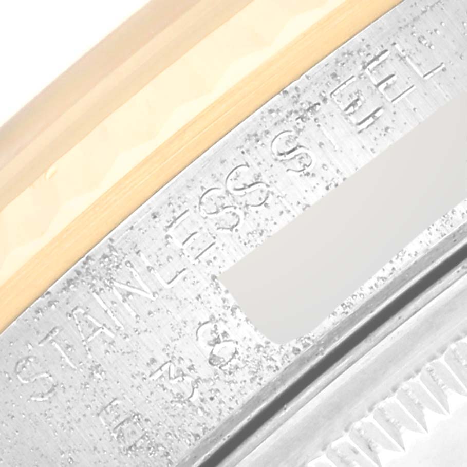 This image shows a close-up of the model and serial number engraving on the stainless steel case of a Rolex Datejust 16233 Men's Steel and Gold (two tone) Champagne Dial 16233 Men's Steel and Gold (two tone) Champagne Dial watch.