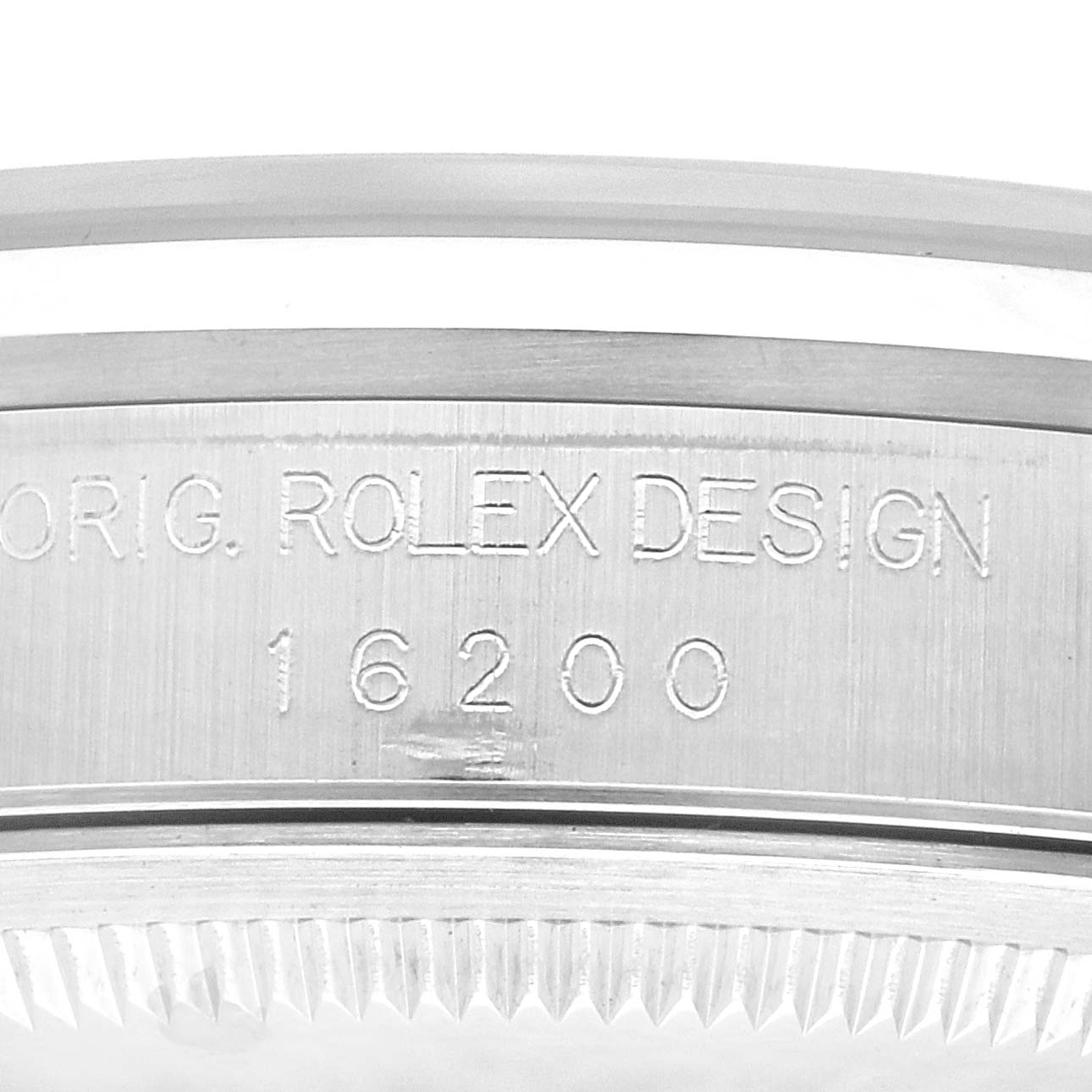 Close-up of the case side of a Rolex Datejust 16200 Men's Stainless Steel Black Dial 16200 Men's Stainless Steel Black Dial showing the inscription with the model number 16200 and "Orig. Rolex Design."