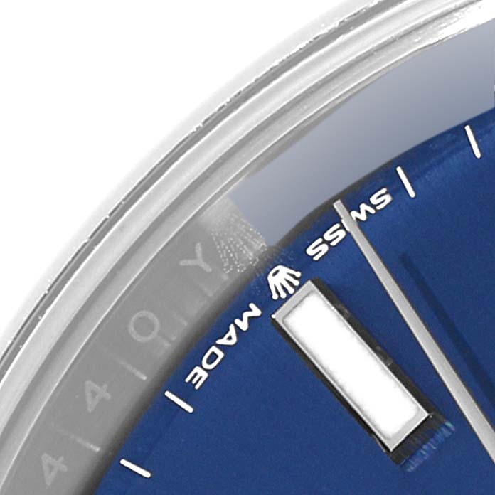 This image shows a close-up of the dial and edge of the Rolex Datejust 41 126300 Men's Stainless Steel Blue Dial 126300 Men's Stainless Steel Blue Dial, highlighting the bezel, "SWISS MADE" text, and part of the date window.