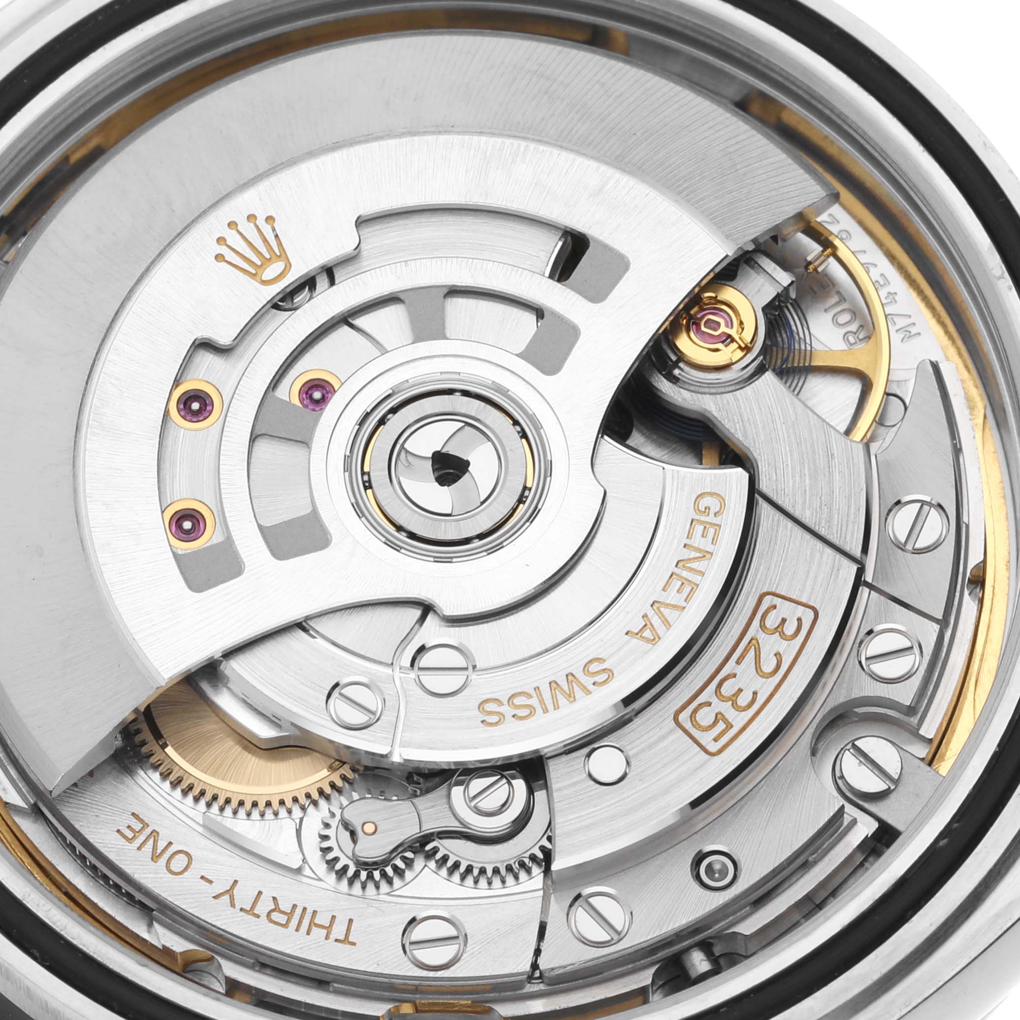 The image shows a close-up view of the movement mechanism of a Rolex Datejust 41 126300 Men's Stainless Steel Blue Dial 126300 Men's Stainless Steel Blue Dial watch, emphasizing the rotor and internal components.