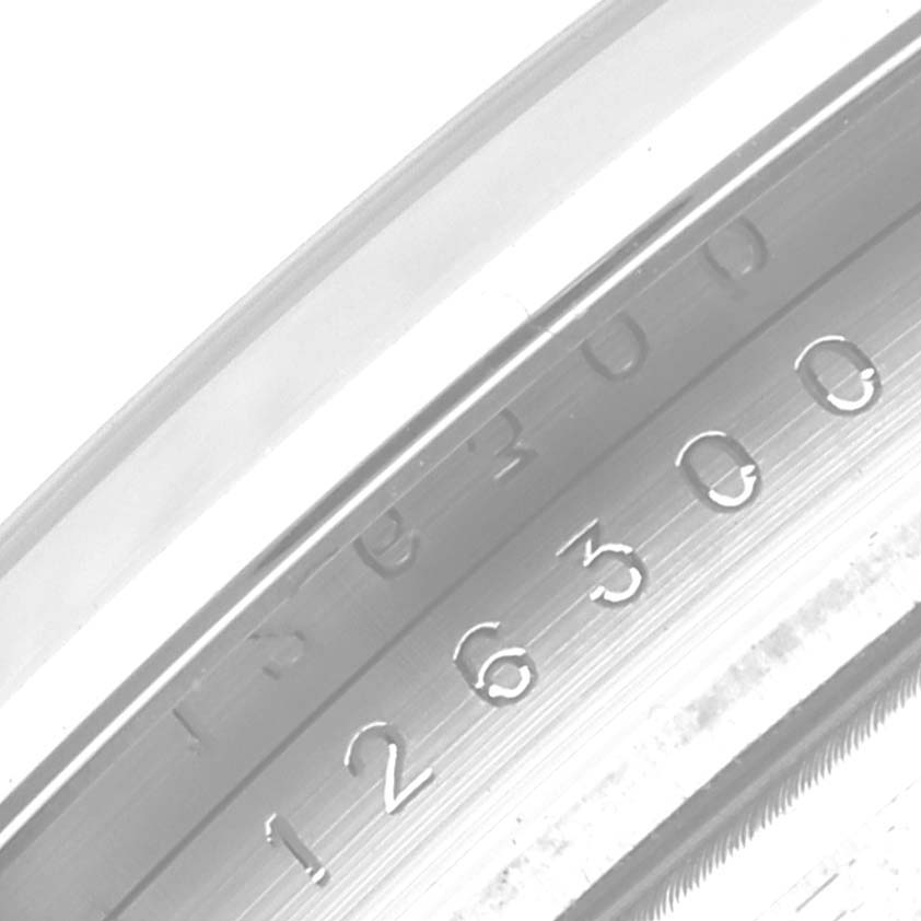 The image shows a close-up of the inner bezel inscriptions on a Rolex Datejust 41 126300 Men's Stainless Steel Blue Dial 126300 Men's Stainless Steel Blue Dial model.