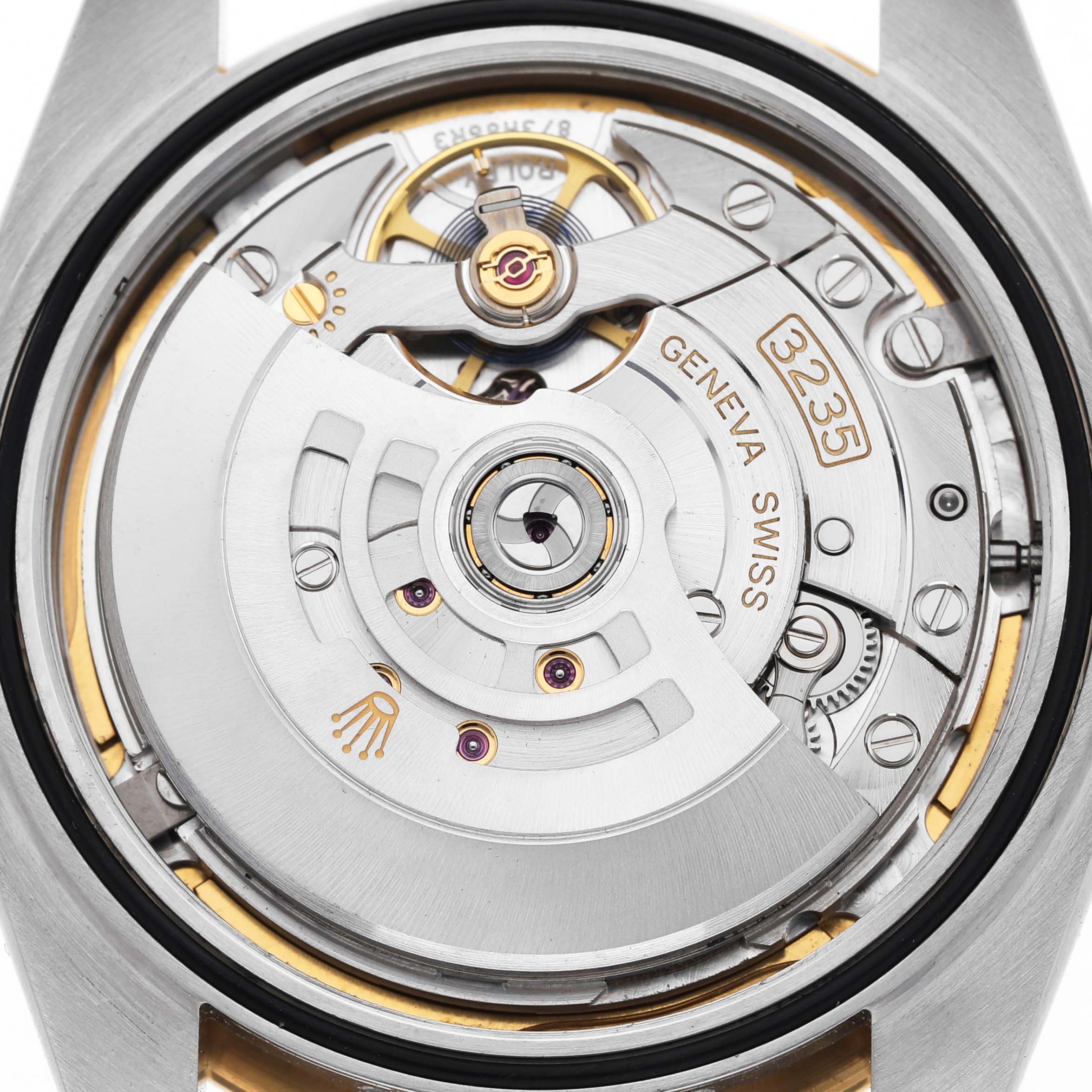 The image shows the movement of a Rolex Datejust 41 126333 Men's Steel and Gold (two tone) Mother of Pearl Dial watch, highlighting its intricate mechanical parts from the back view.