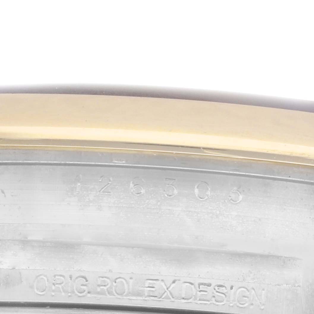 The image shows a close-up of the side of the Rolex Datejust 41 126303 Men's Steel and Gold (two tone) Grey Dial 126303 Men's Steel and Gold (two tone) Grey Dial case, highlighting the engraving details.